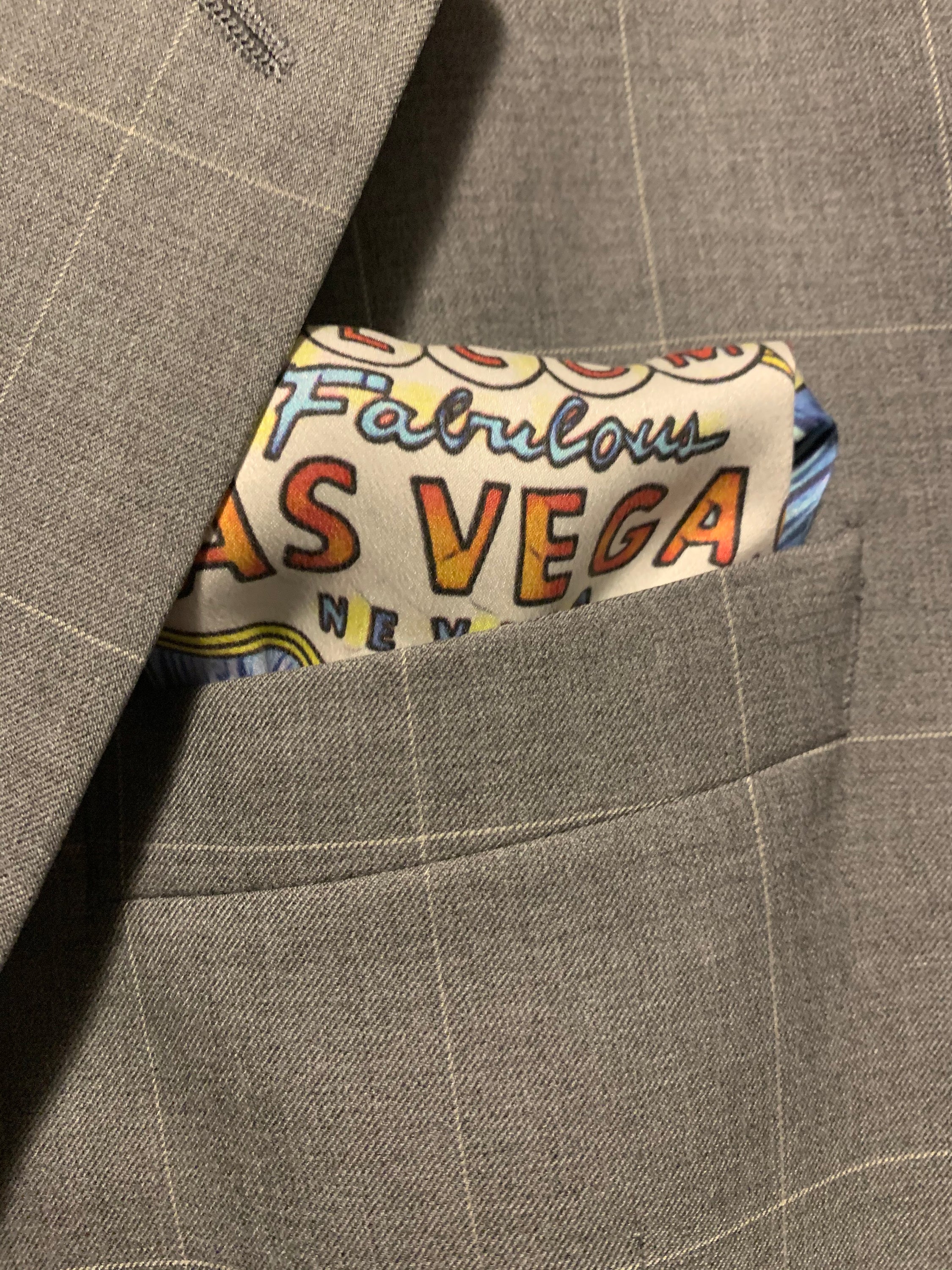 Fabulous Las Vegas Sky Blue Pocket Square featuring a hand-sketched design of the New York New York hotel in vibrant colors.