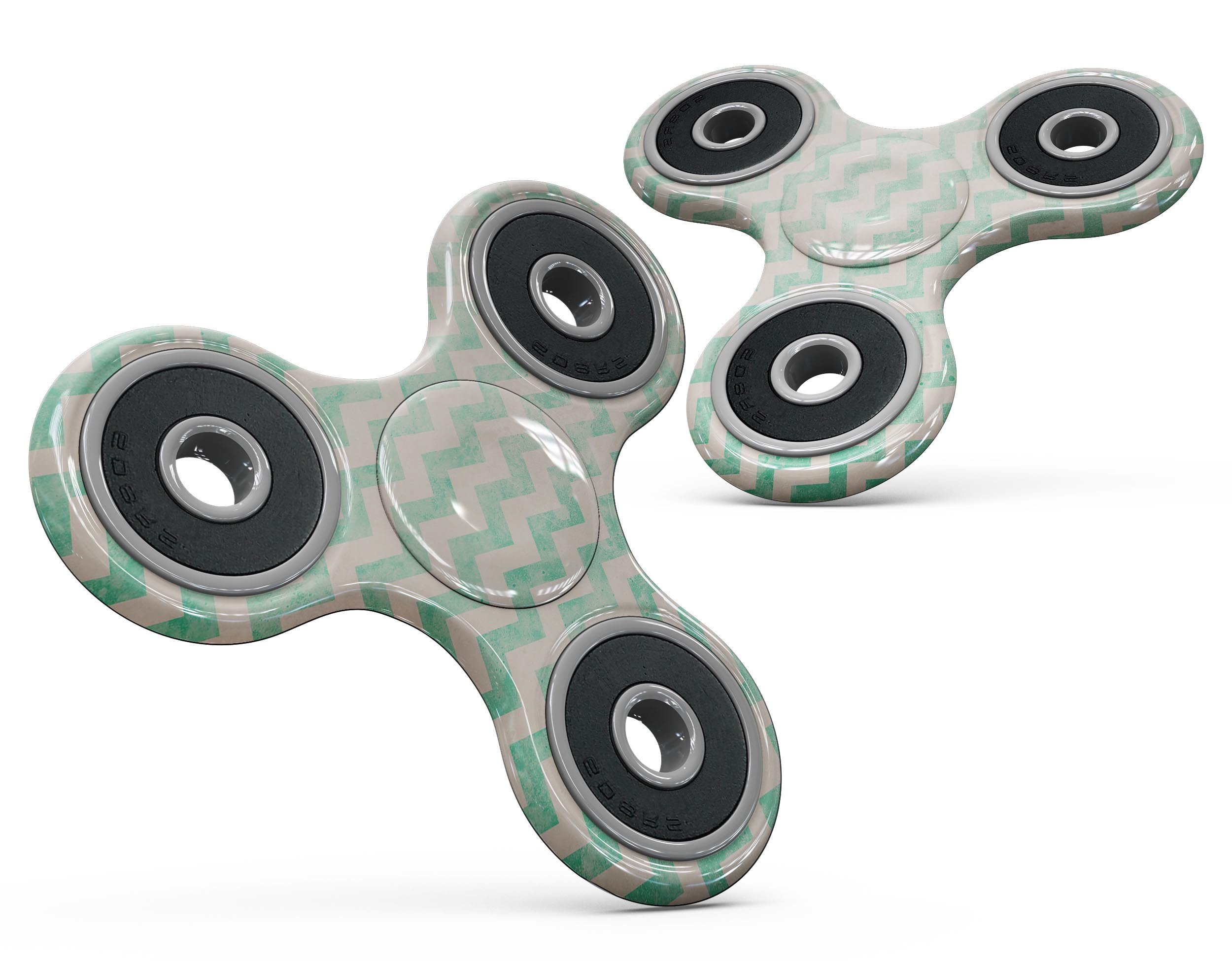 Faded aqua chevron pattern skin kit for fidget spinner, showcasing vibrant colors and unique design.