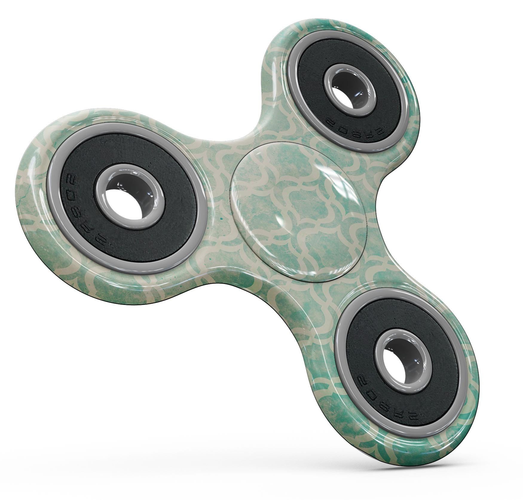 Faded teal oval pattern skin kit for fidget spinner, showcasing vibrant colors and unique design.