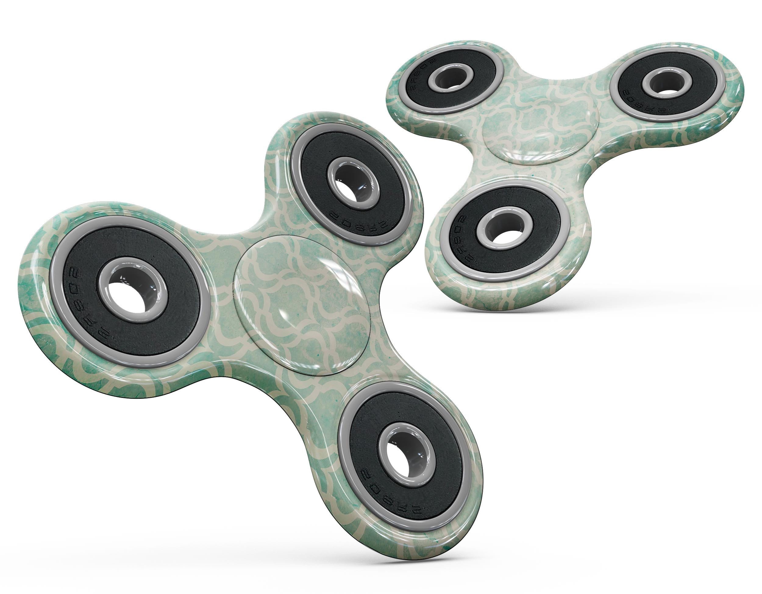 Faded teal oval pattern skin kit for fidget spinner, showcasing vibrant colors and unique design.