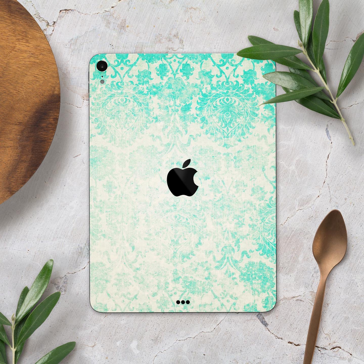 Faded teal pattern skin decal for Apple devices, showcasing intricate design and premium finish.