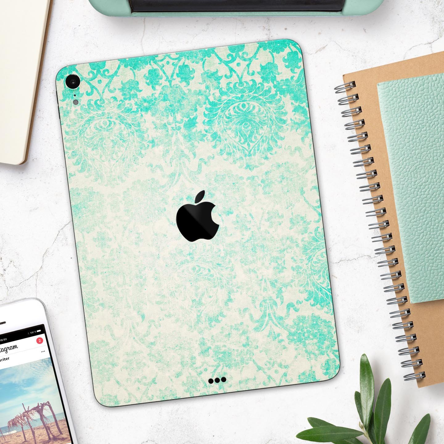 Faded teal pattern skin decal for Apple devices, showcasing intricate design and premium finish.