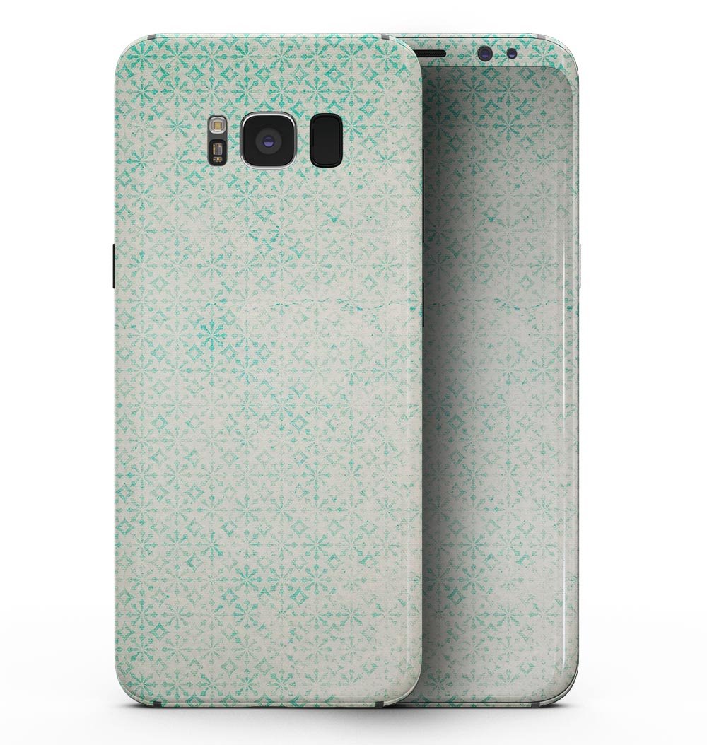 Faded teal snowflake pattern skin for Samsung Galaxy S8, showcasing intricate design and premium vinyl material.