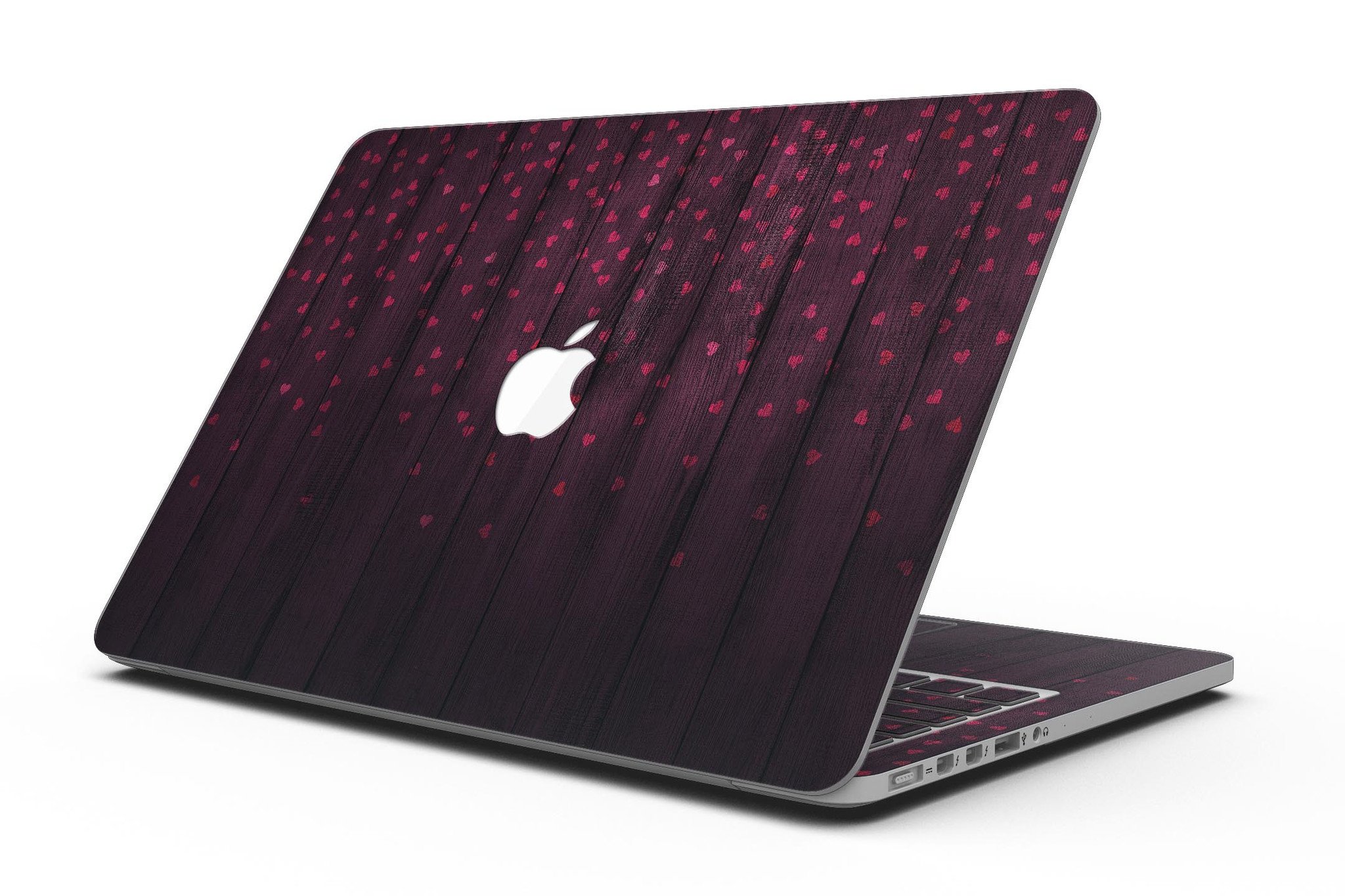 Falling Micro Hearts design skin for MacBook Pro, featuring a burgundy wood background and stylish heart patterns.