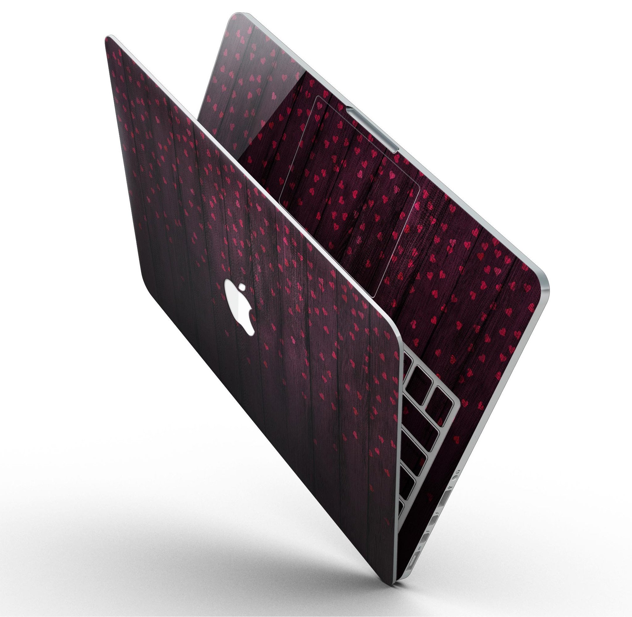 Falling Micro Hearts design skin for MacBook Pro, featuring a burgundy wood background and stylish heart patterns.