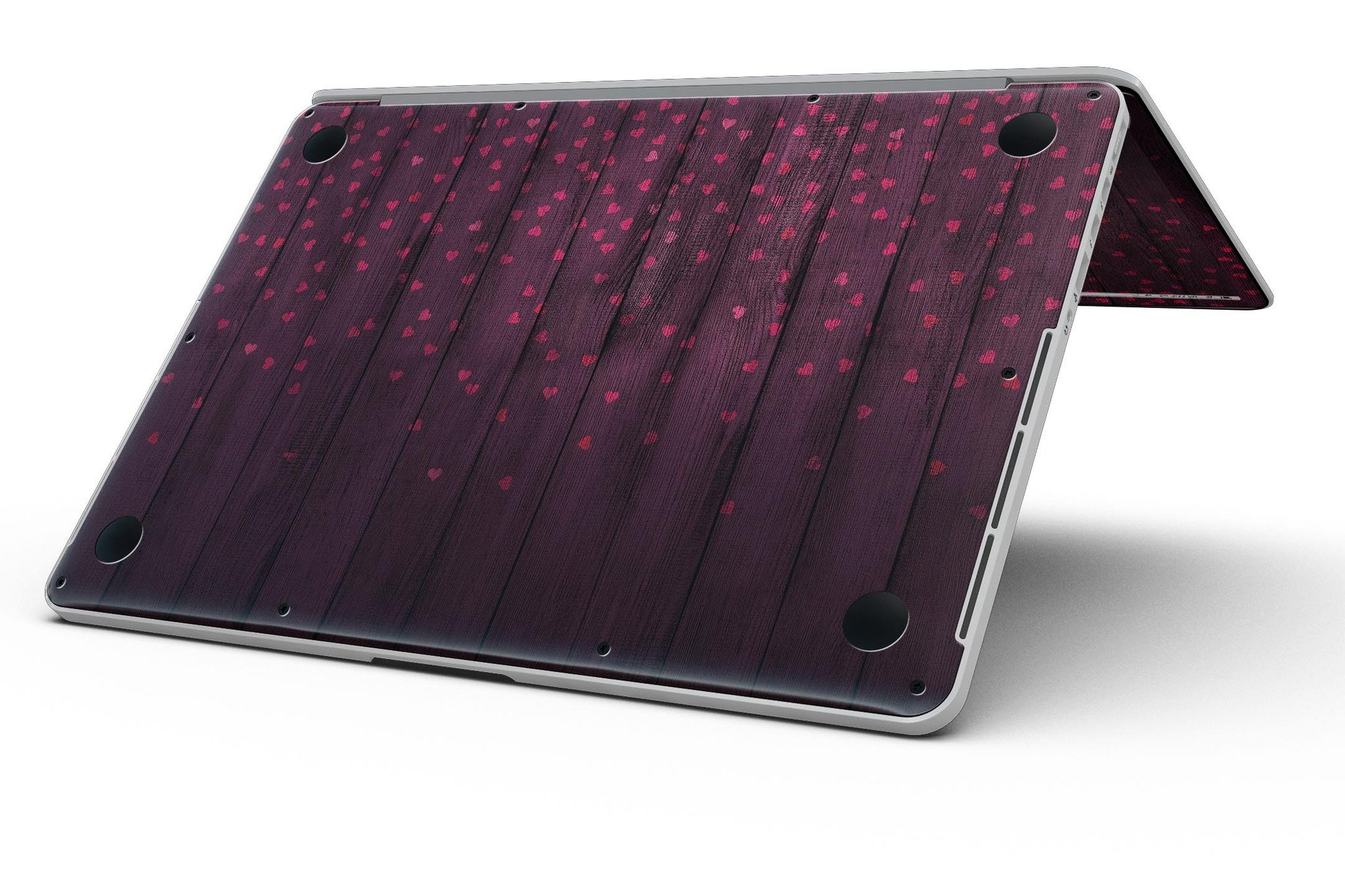 Falling Micro Hearts design skin for MacBook Pro, featuring a burgundy wood background and stylish heart patterns.