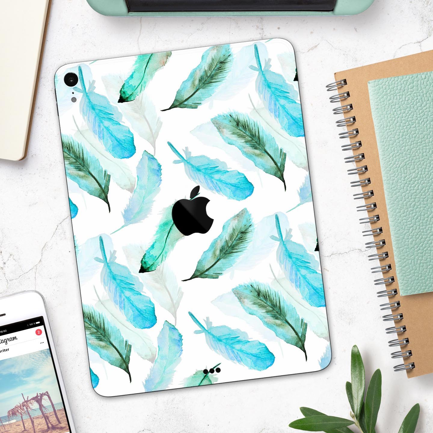 Feathery Watercolor skin decal for Apple iPad Pro, showcasing vibrant colors and a sleek design, providing full-body protection.