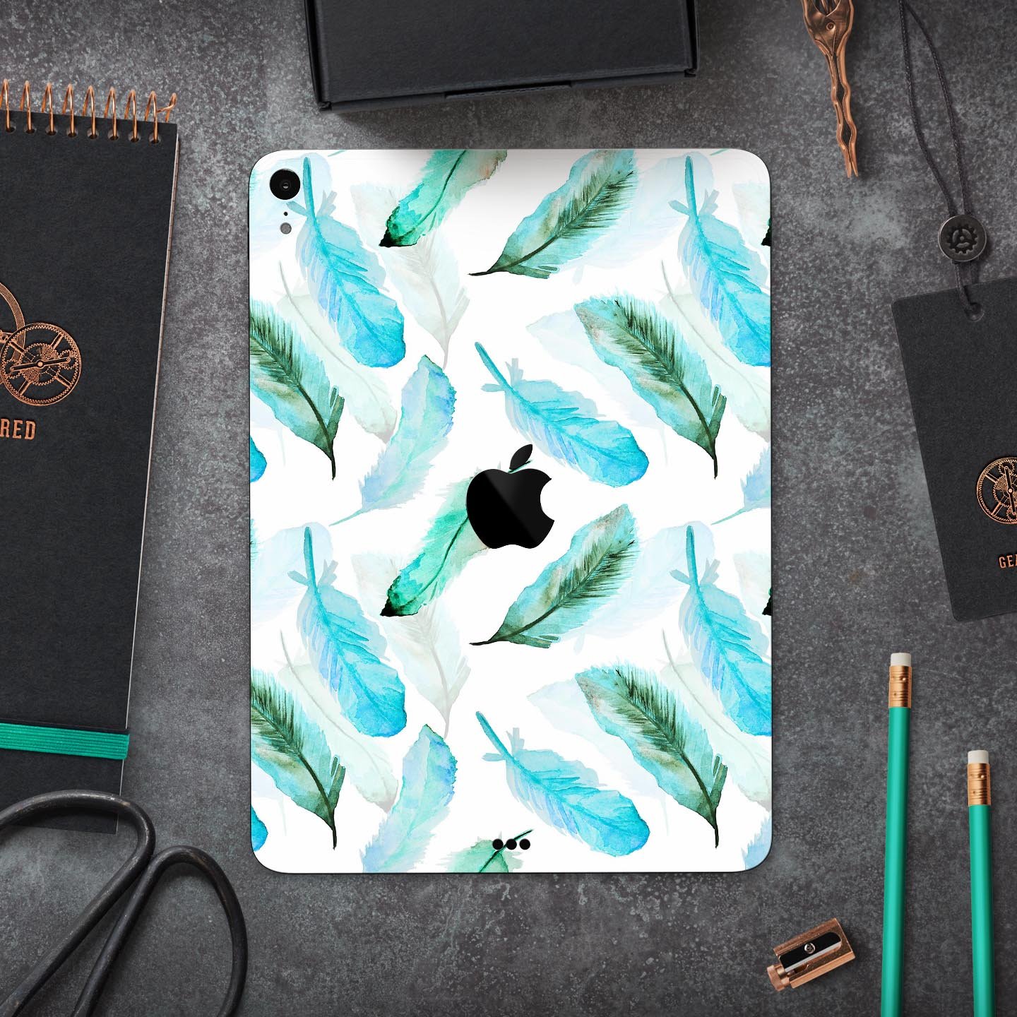 Feathery Watercolor skin decal for Apple iPad Pro, showcasing vibrant colors and a sleek design, providing full-body protection.