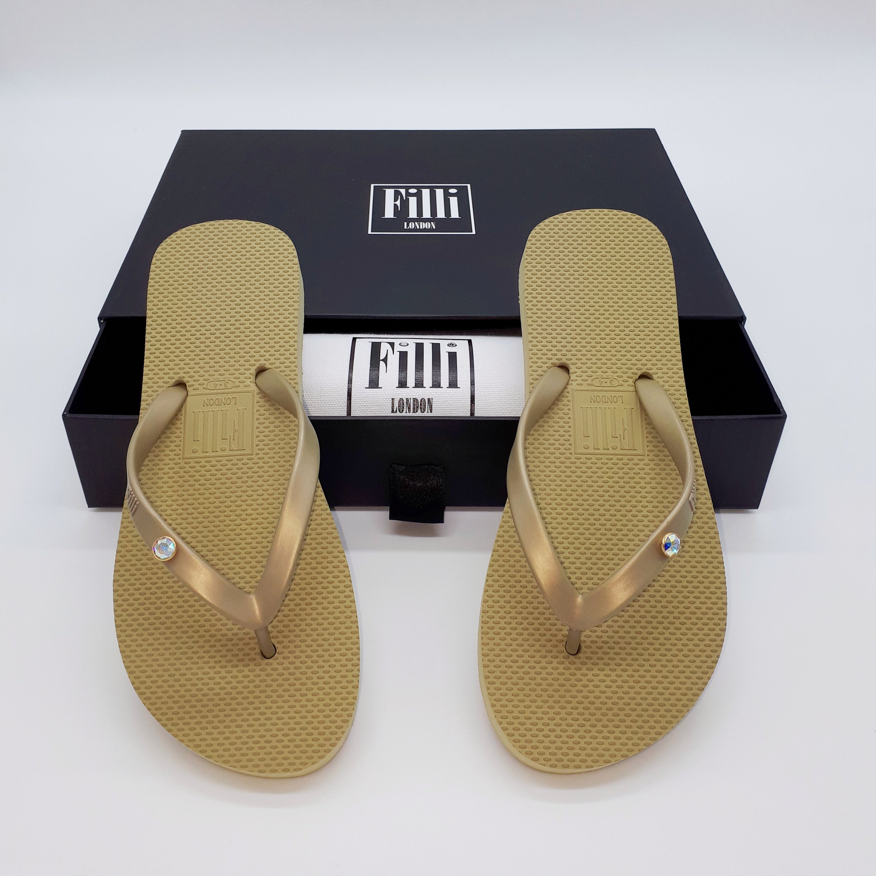 Filli London Aurora Luxury Crystal Flip Flops in Gold, featuring Swarovski® crystals and a stylish design.