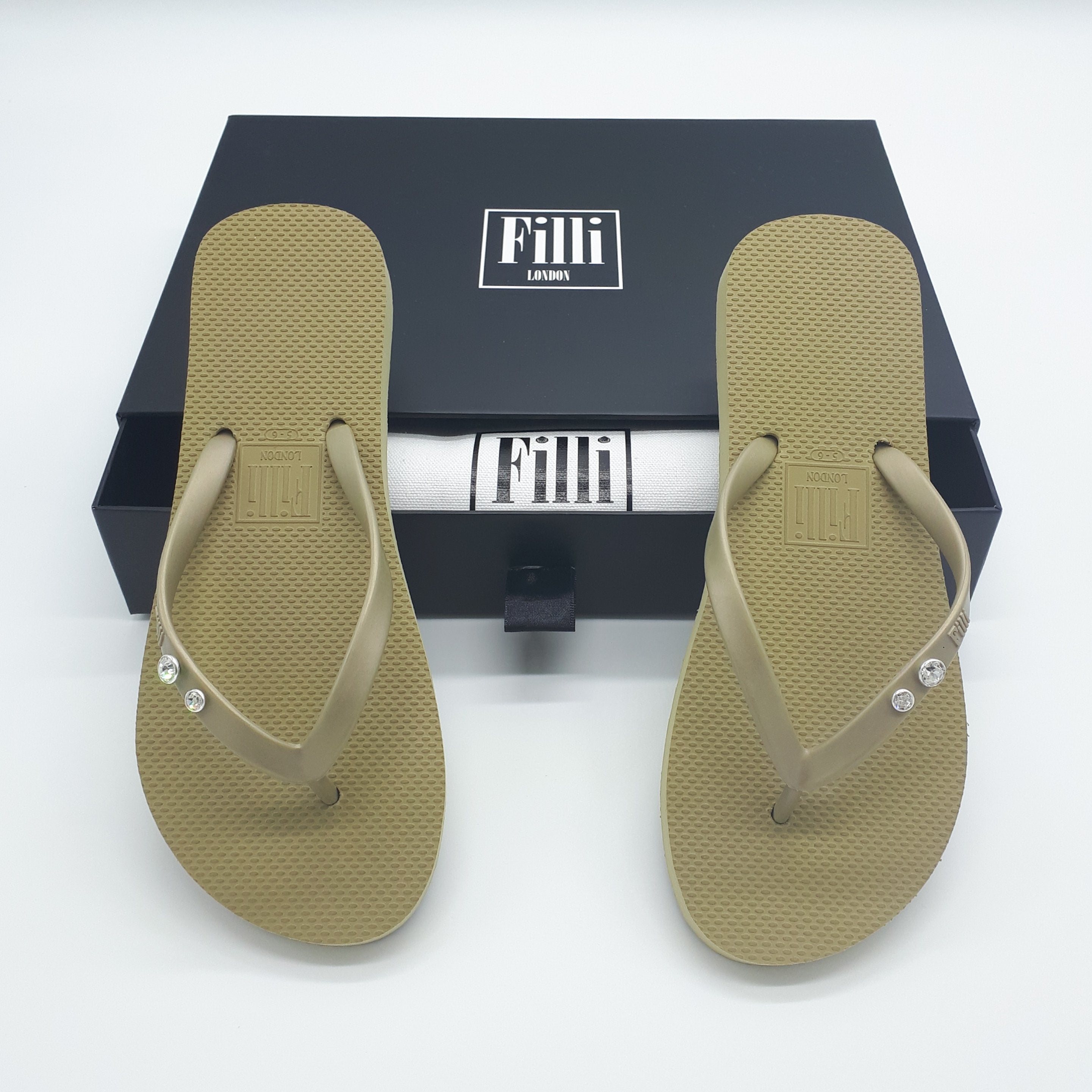 Filli London Crystal Diamond flip flops featuring Swarovski® crystals in gold setting, elegantly designed for comfort and style.