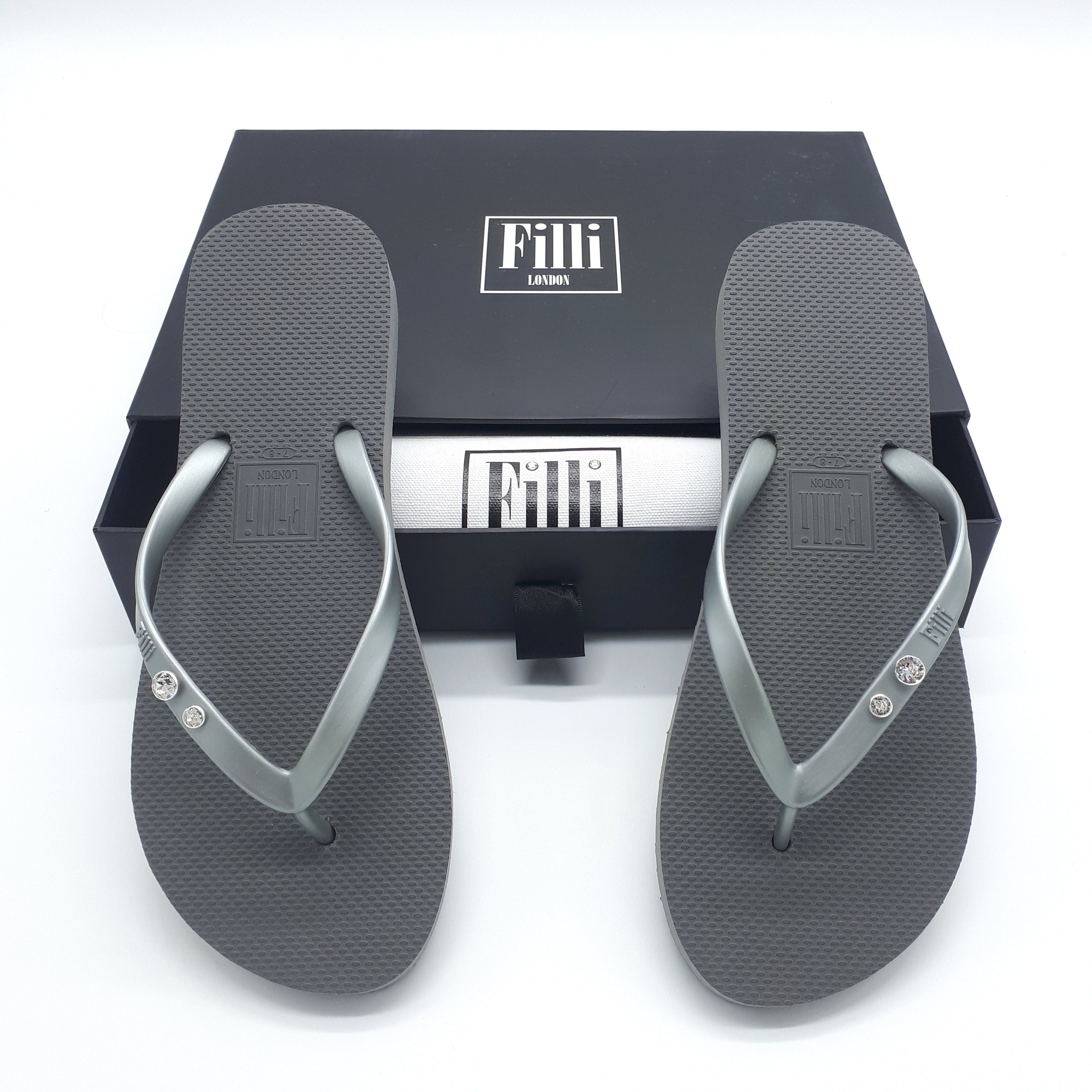 Filli London Crystal Diamond flip flops featuring Swarovski® crystals in a silver setting, elegantly designed for comfort and style.