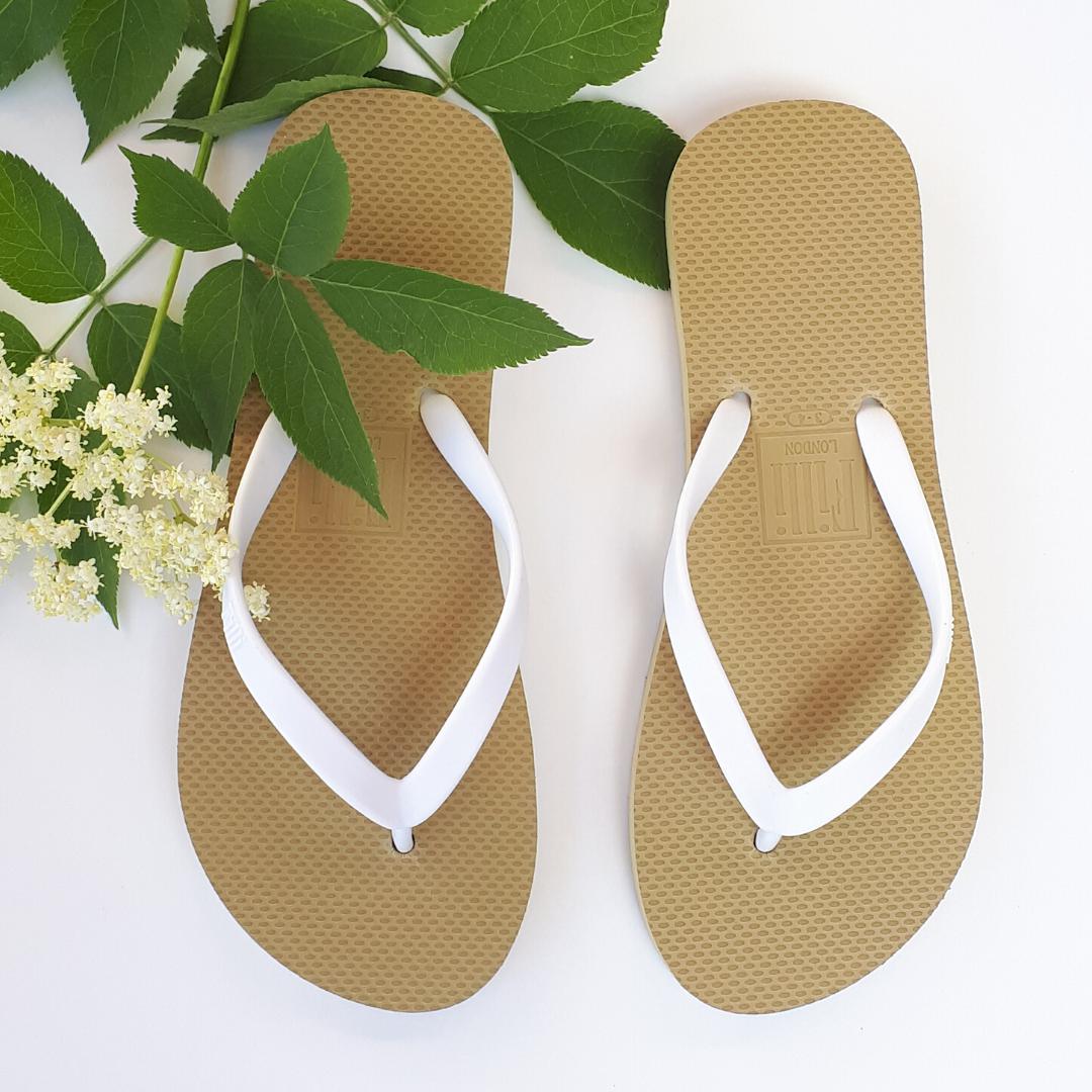 Filli London Naked Flip Flops in White on Gold with embossed logo and smooth straps.