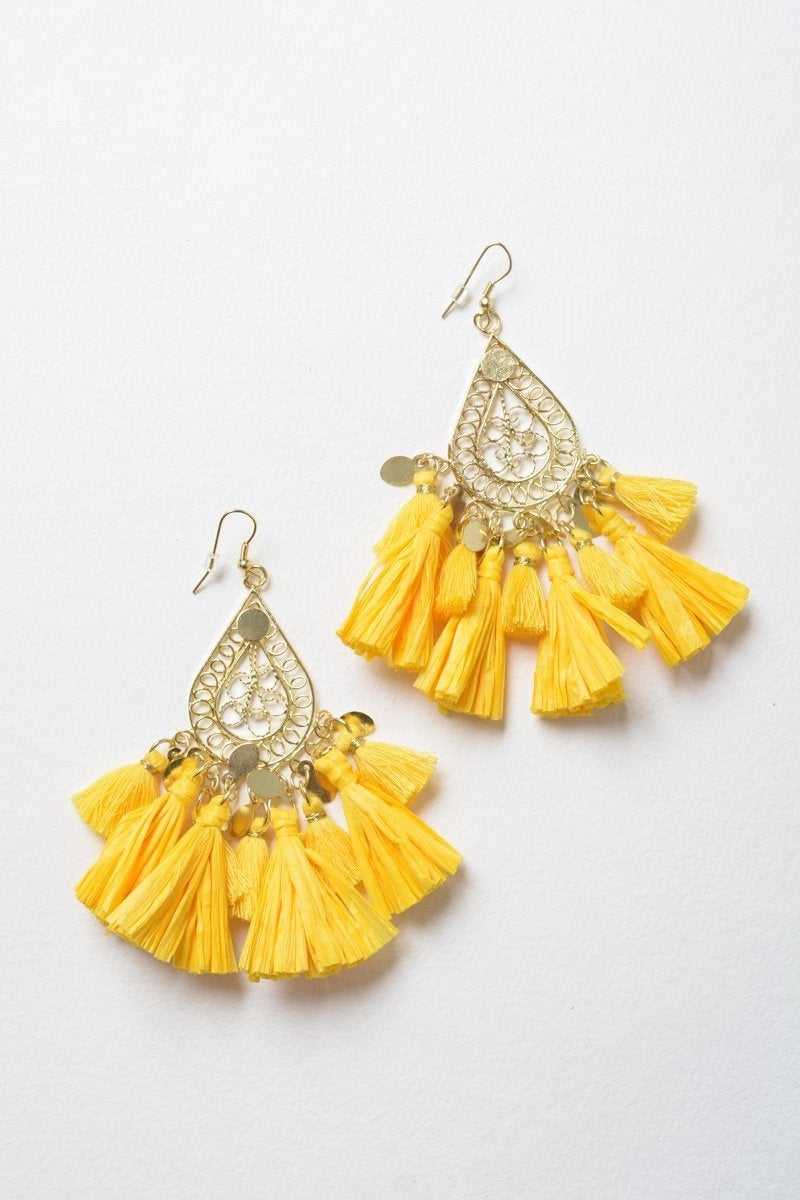 Elegant Filigree Raffia Tassel Earrings featuring intricate brass design and soft tassels, perfect for stylish accessorizing.