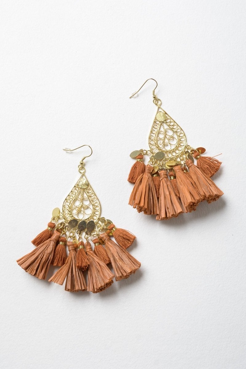 Elegant Filigree Raffia Tassel Earrings featuring intricate brass design and soft tassels, perfect for stylish accessorizing.