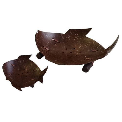 Fish-shaped soap dish made from coconut, featuring a natural finish and two small sticks as a base.