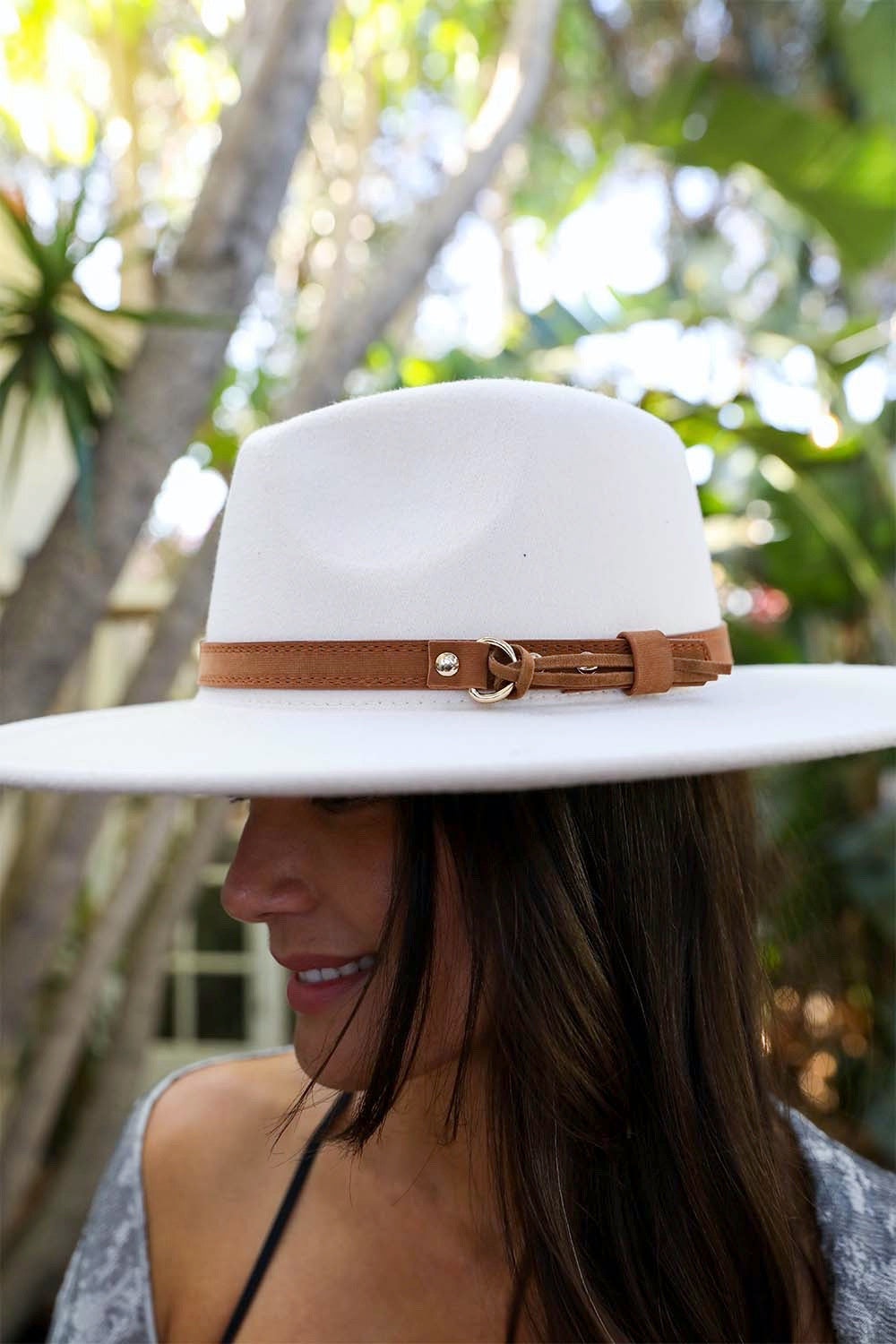 A stylish Flat Brim Buckle Hat featuring a flat brim and elegant buckle detail, made from soft polyester fabric.