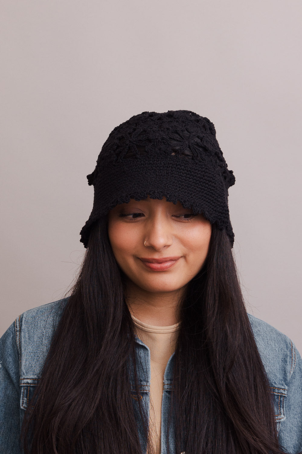 A stylish Floral Crochet Bucket Sun Hat featuring delicate floral crochet detailing, perfect for summer outings and sun protection.