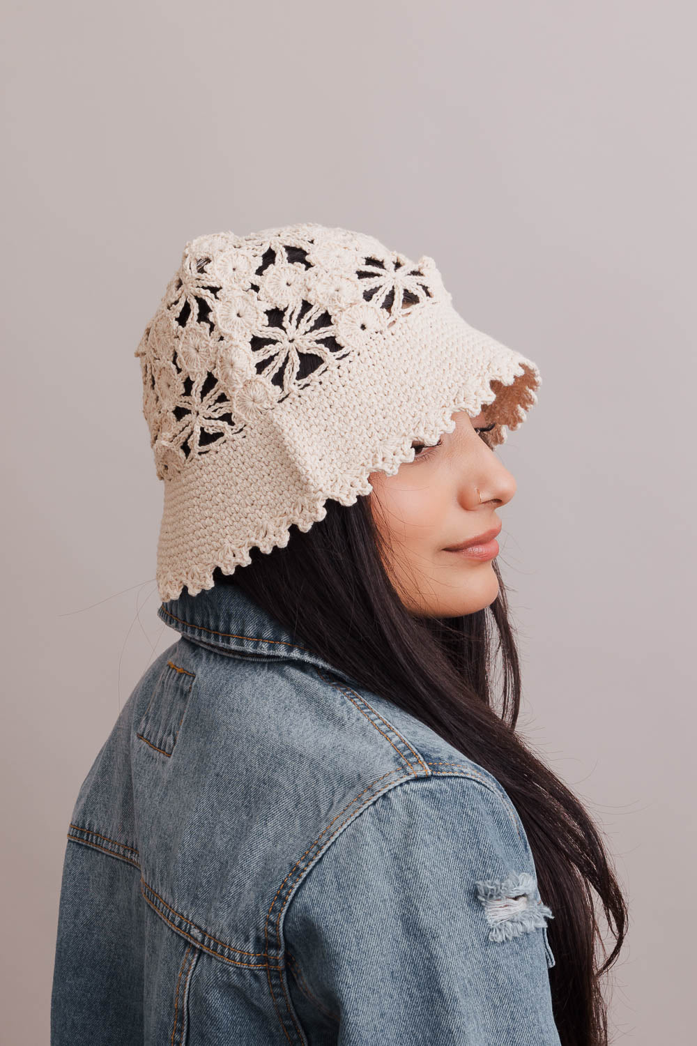 A stylish Floral Crochet Bucket Sun Hat featuring delicate floral crochet detailing, perfect for summer outings and sun protection.