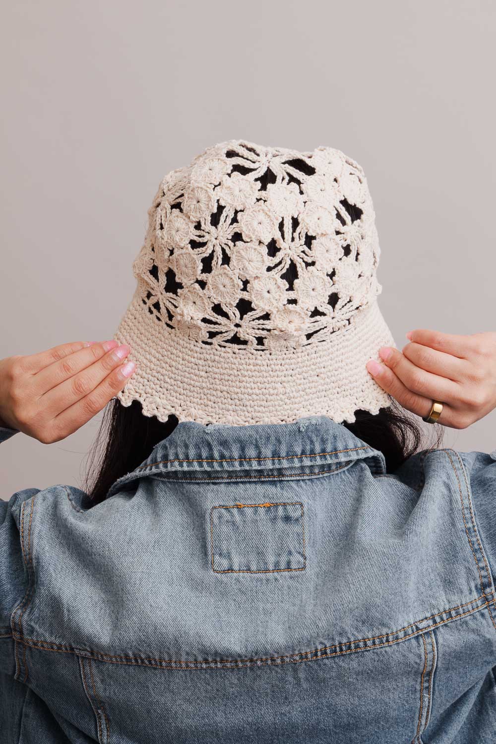 A stylish Floral Crochet Bucket Sun Hat featuring delicate floral crochet detailing, perfect for summer outings and sun protection.