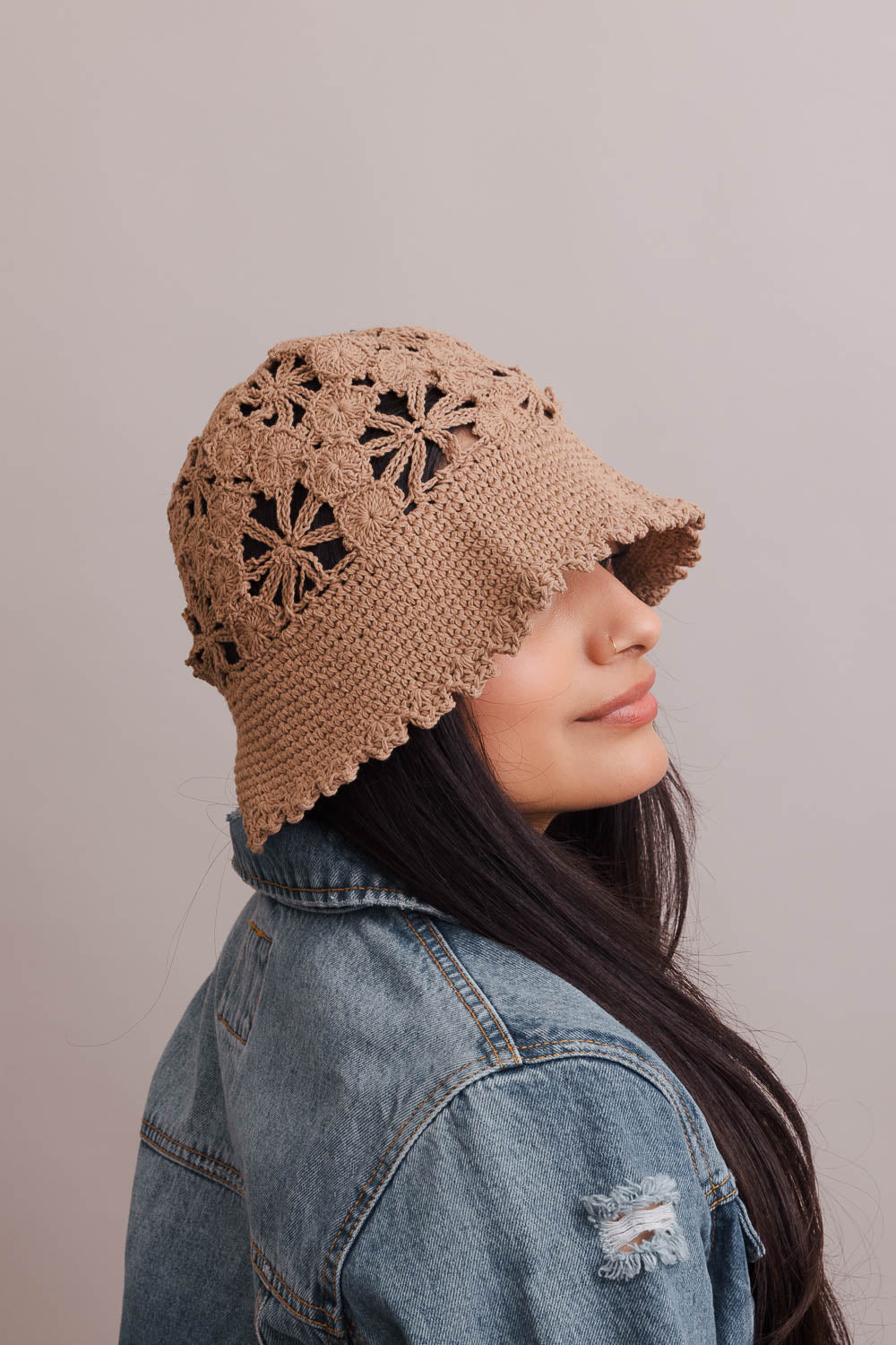 A stylish Floral Crochet Bucket Sun Hat featuring delicate floral crochet detailing, perfect for summer outings and sun protection.