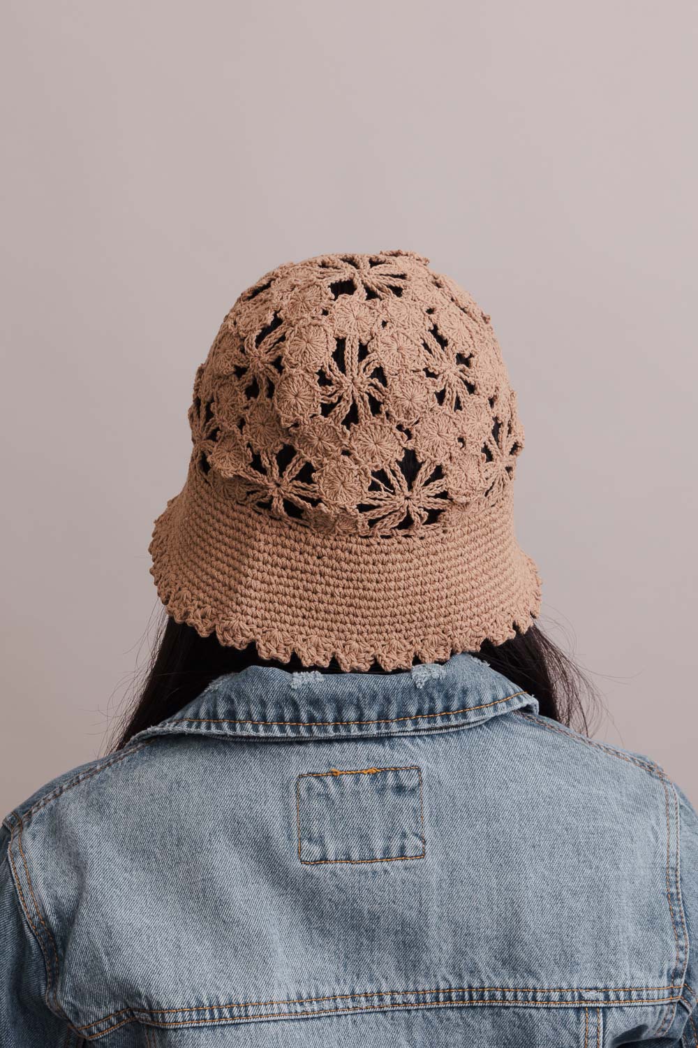 A stylish Floral Crochet Bucket Sun Hat featuring delicate floral crochet detailing, perfect for summer outings and sun protection.