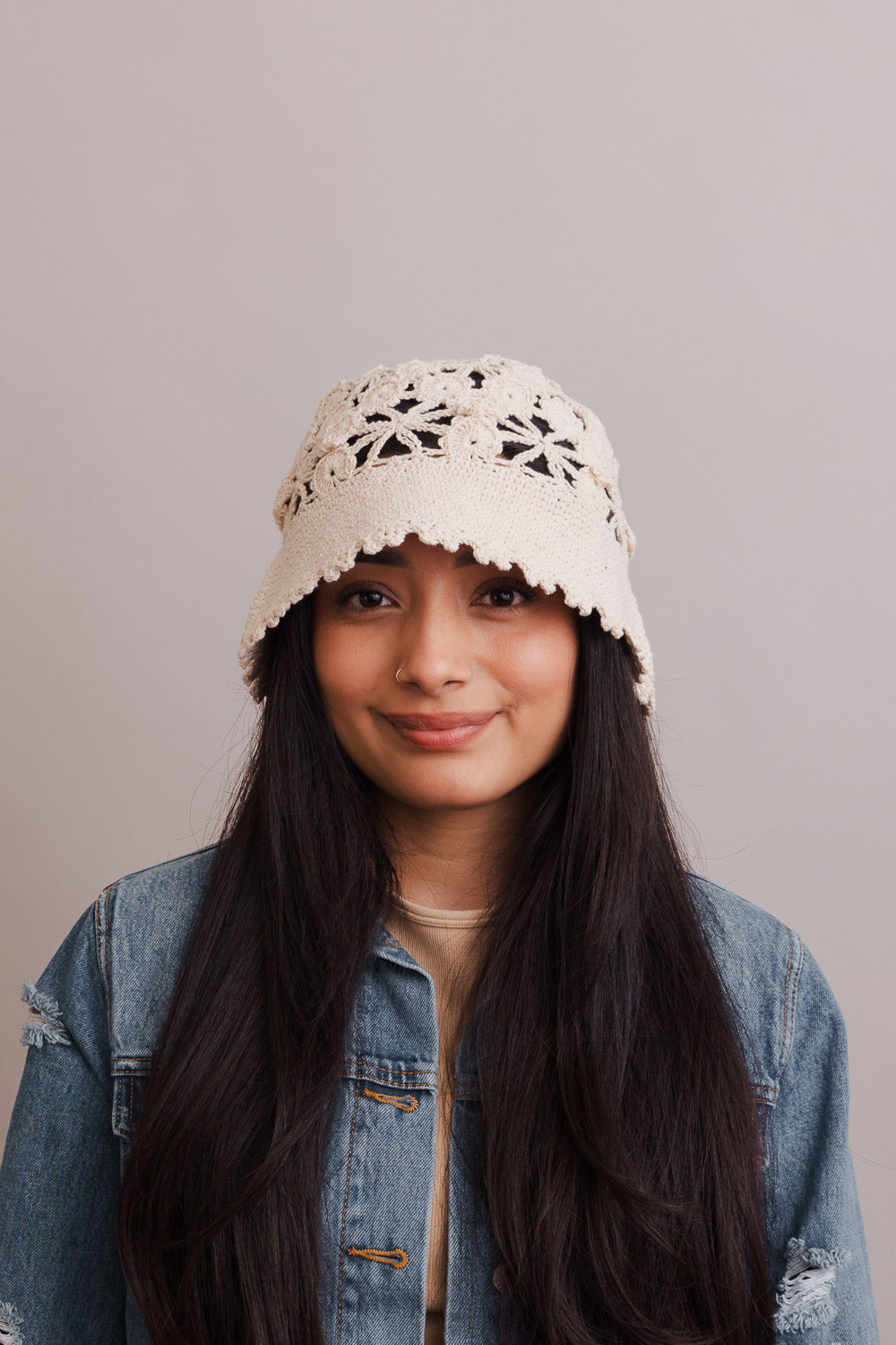 A stylish Floral Crochet Bucket Sun Hat featuring delicate floral crochet detailing, perfect for summer outings and sun protection.