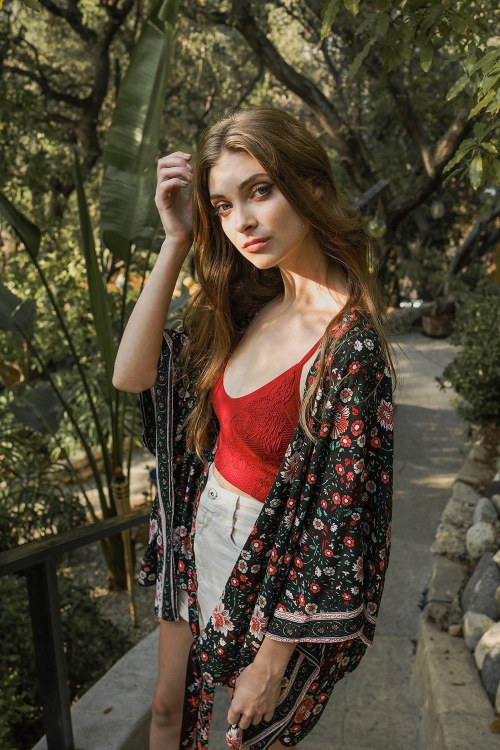 A lightweight floral front tie kimono wrap, perfect for summer outings, featuring vibrant colors and a flattering design.