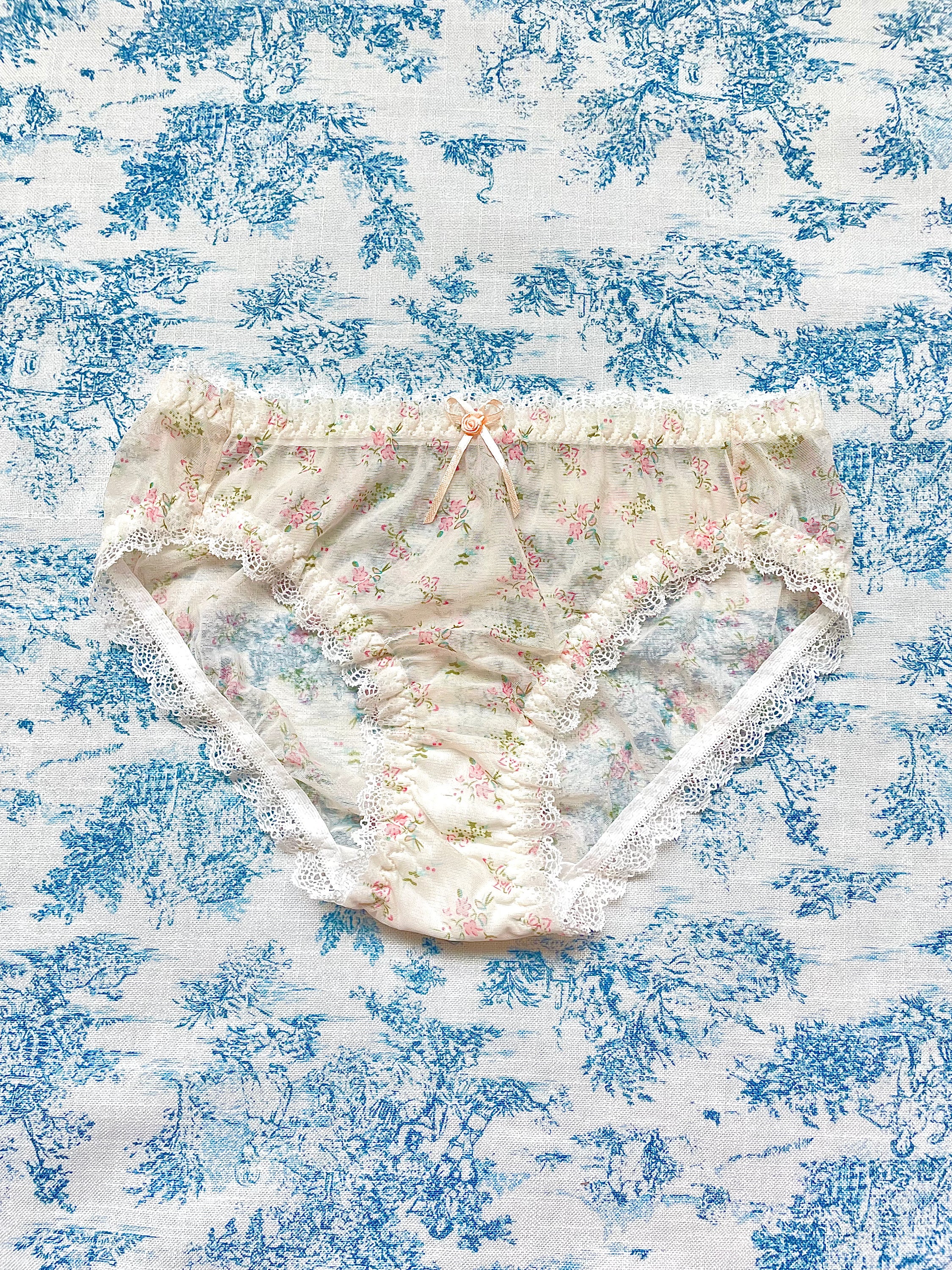 Floral Lace Trim Panty featuring ivory mesh, floral print, lace trim, and bow details, perfect for comfort and style.