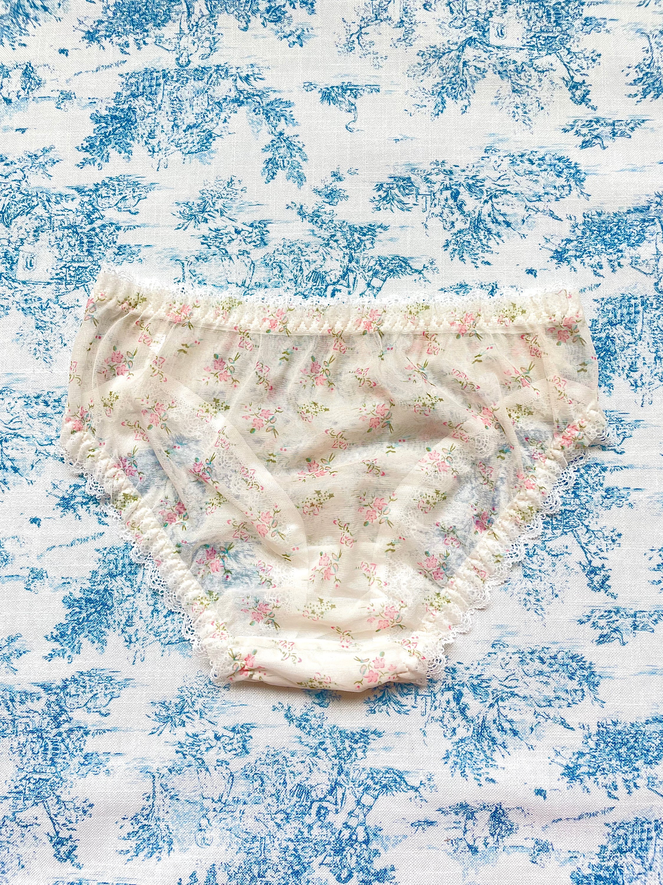 Floral Lace Trim Panty featuring ivory mesh, floral print, lace trim, and bow details, perfect for comfort and style.