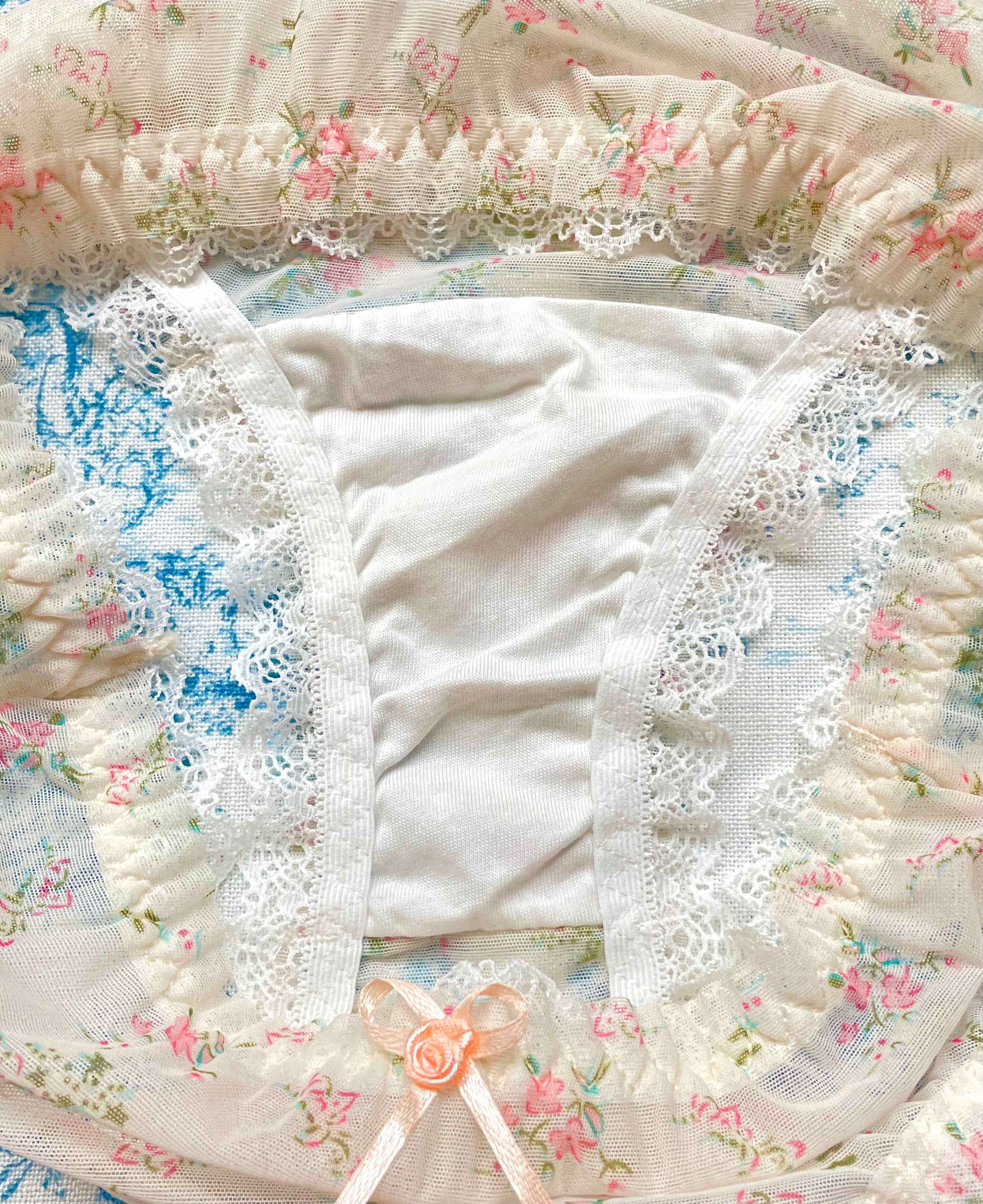 Floral Lace Trim Panty featuring ivory mesh, floral print, lace trim, and bow details, perfect for comfort and style.