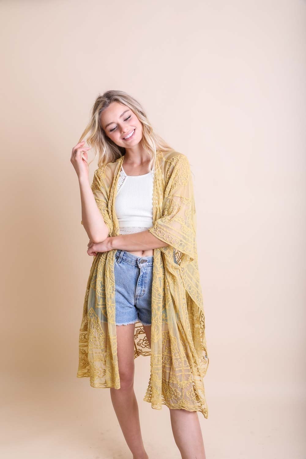 A lightweight floral mandala mesh kimono featuring intricate embroidery, perfect for casual wear.