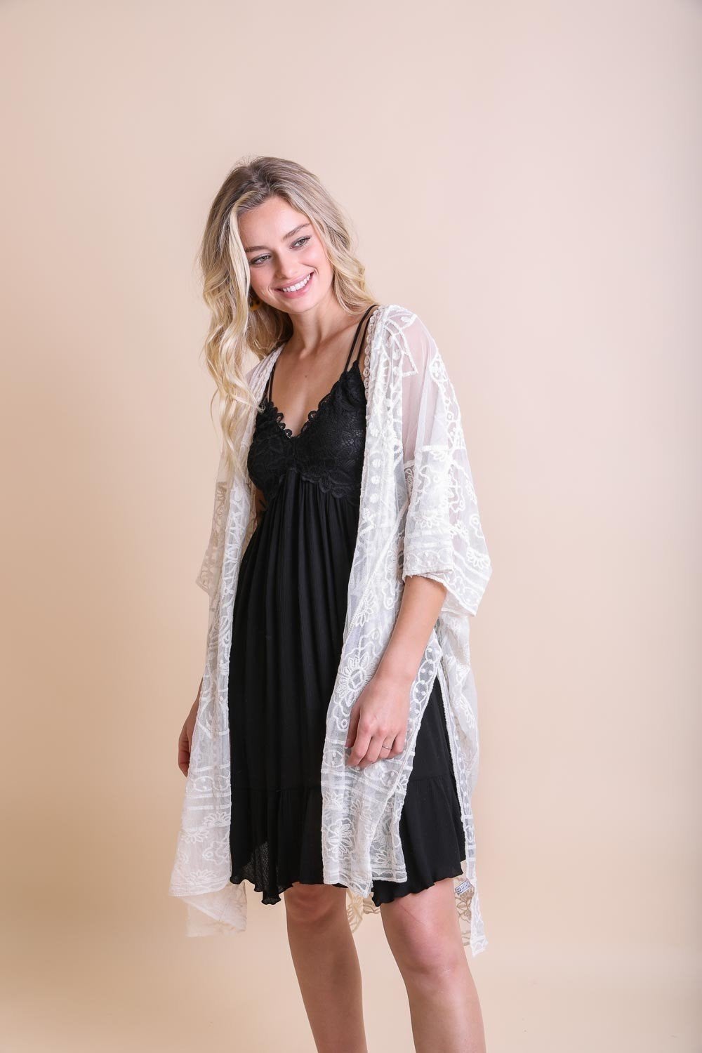 A lightweight floral mandala mesh kimono featuring intricate embroidery, perfect for casual wear.