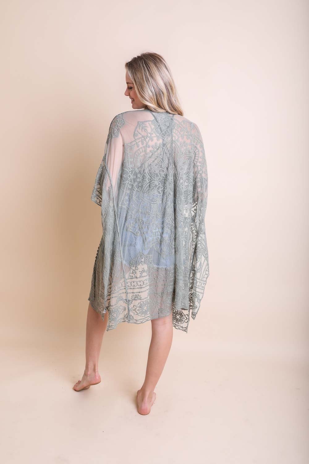 A lightweight floral mandala mesh kimono featuring intricate embroidery, perfect for casual wear.