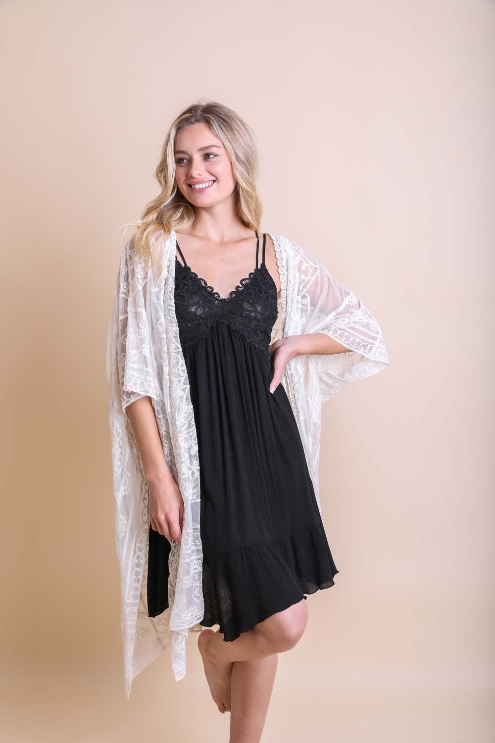 A lightweight floral mandala mesh kimono featuring intricate embroidery, perfect for casual wear.