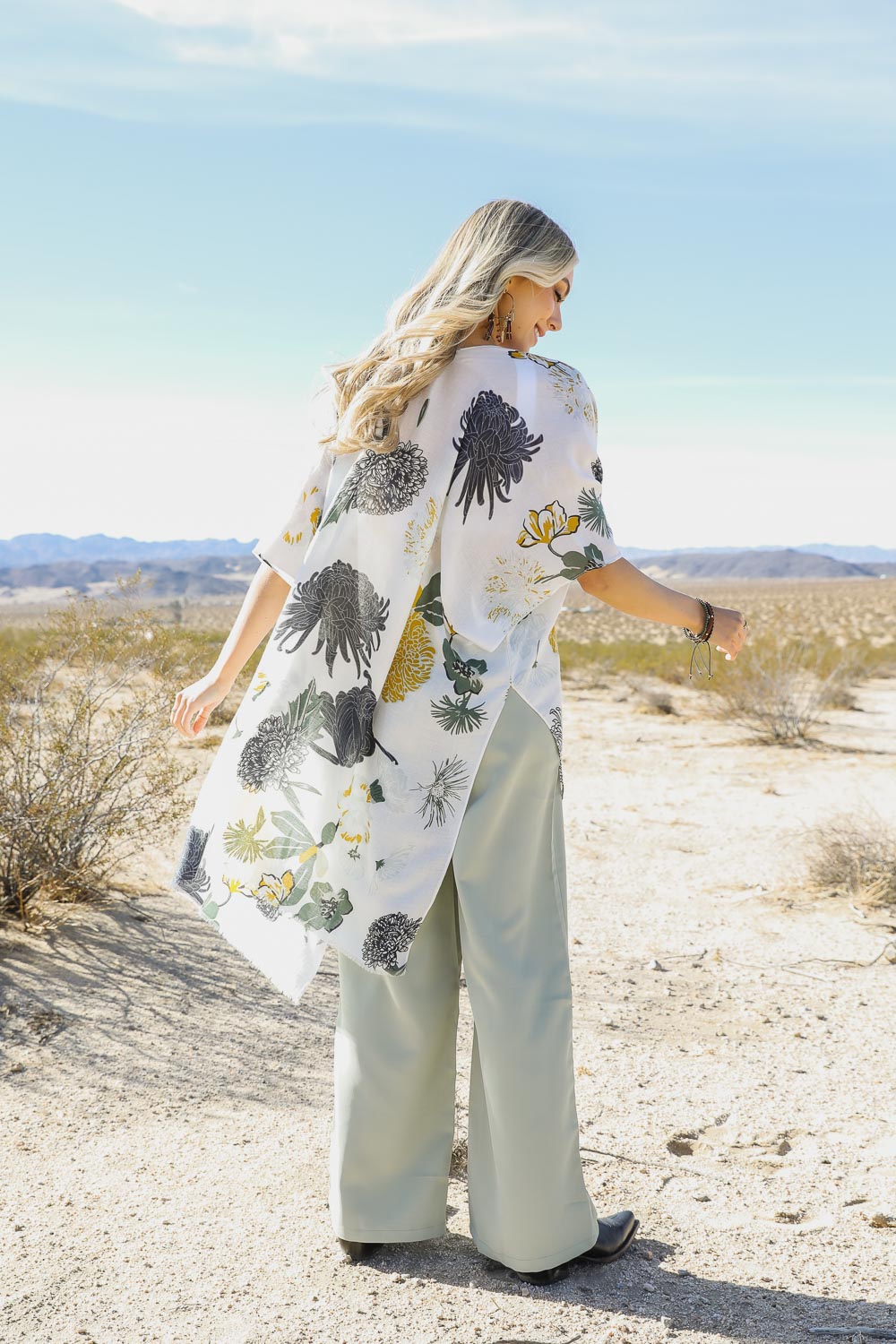 A stylish Floral Motif Combo Kimono featuring vibrant floral patterns, lightweight fabric, and a versatile design suitable for summer wear.