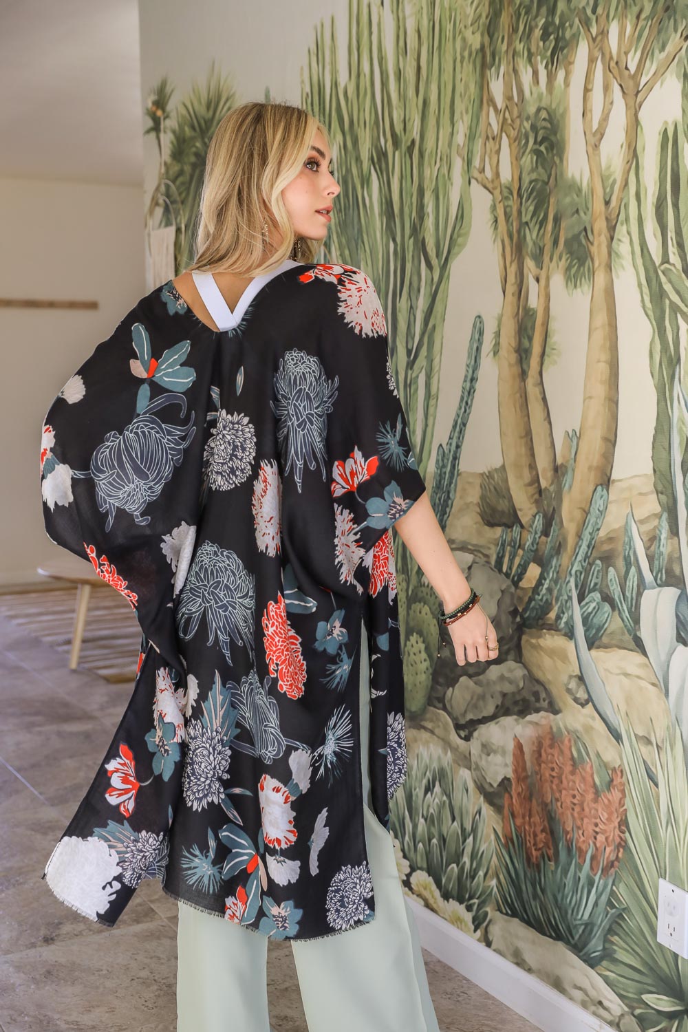 A stylish Floral Motif Combo Kimono featuring vibrant floral patterns, lightweight fabric, and a versatile design suitable for summer wear.