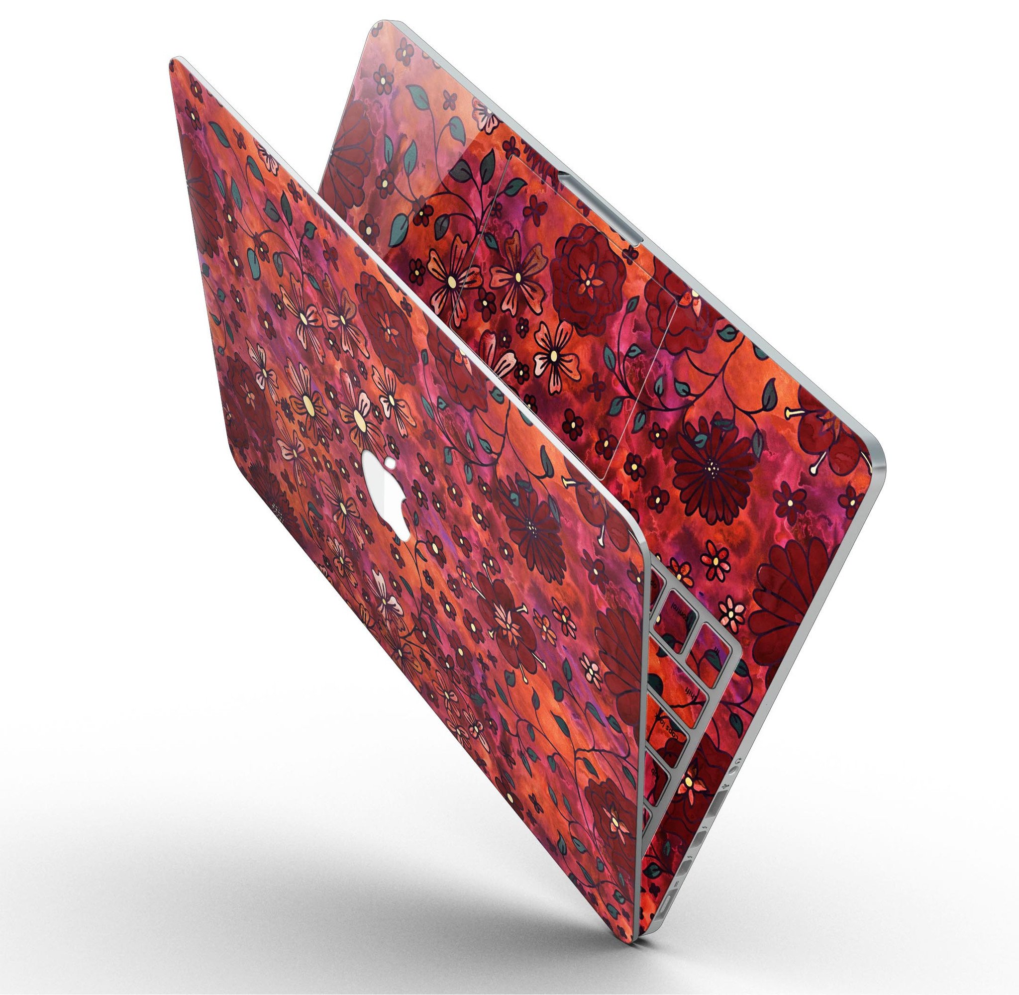 Floral pattern skin on a MacBook Pro with Retina Display, showcasing vibrant red watercolor design.