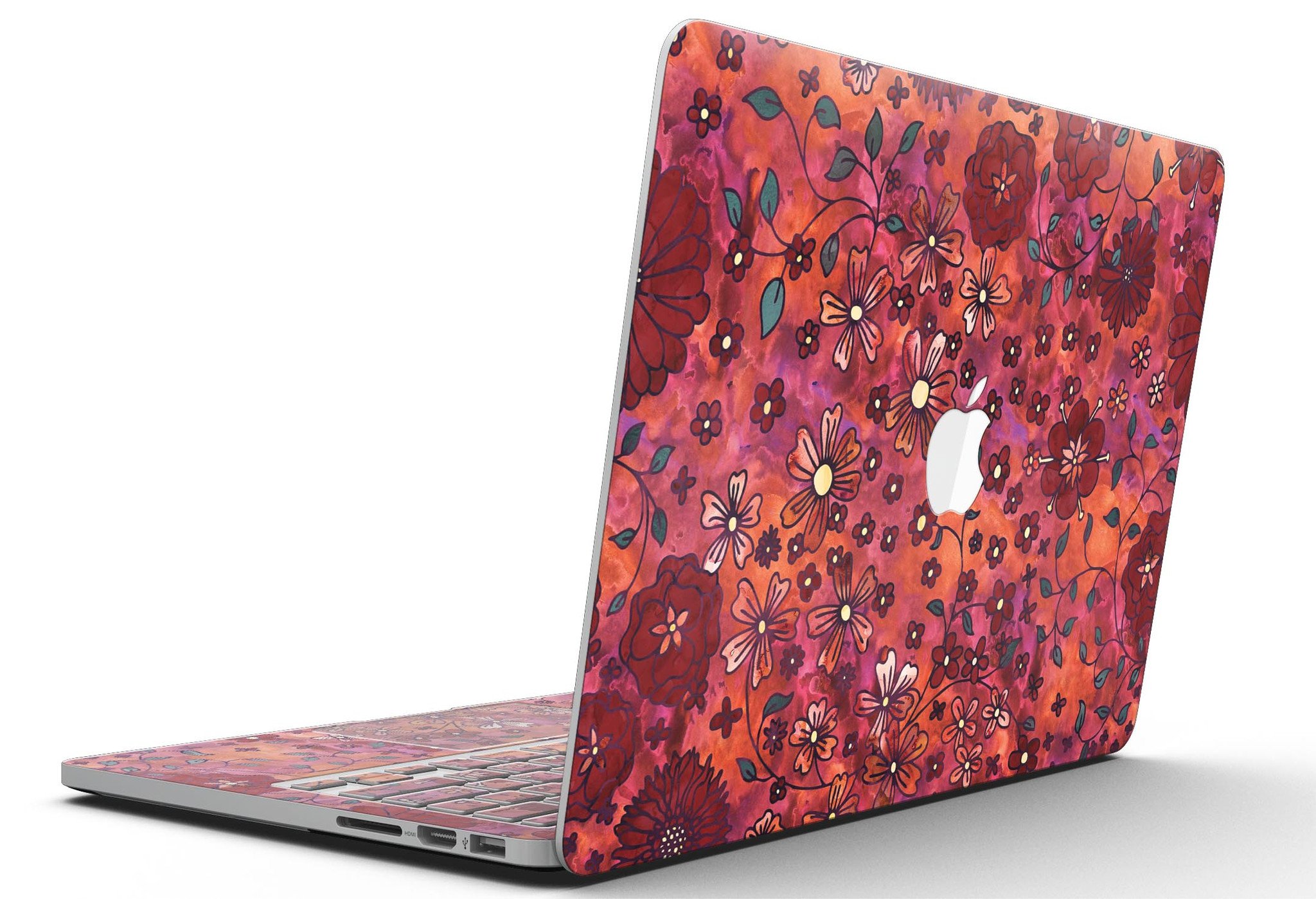 Floral pattern skin on a MacBook Pro with Retina Display, showcasing vibrant red watercolor design.