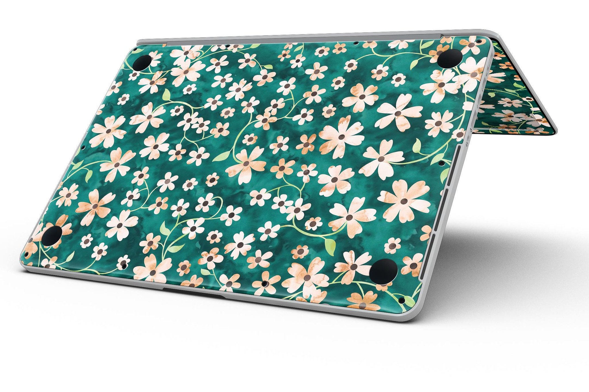 MacBook Pro with a floral design skin featuring stems over deep green watercolor background.