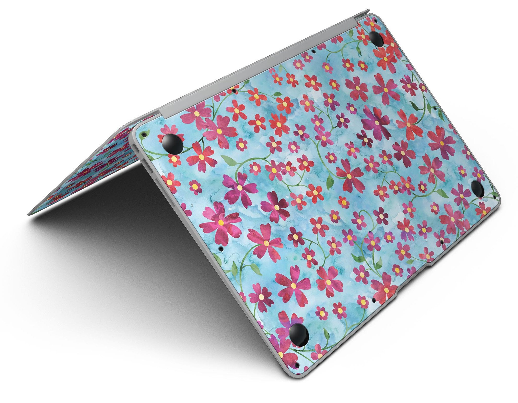 A MacBook Air adorned with a Flowers with Stems skin over a light blue watercolor background, showcasing its stylish design.