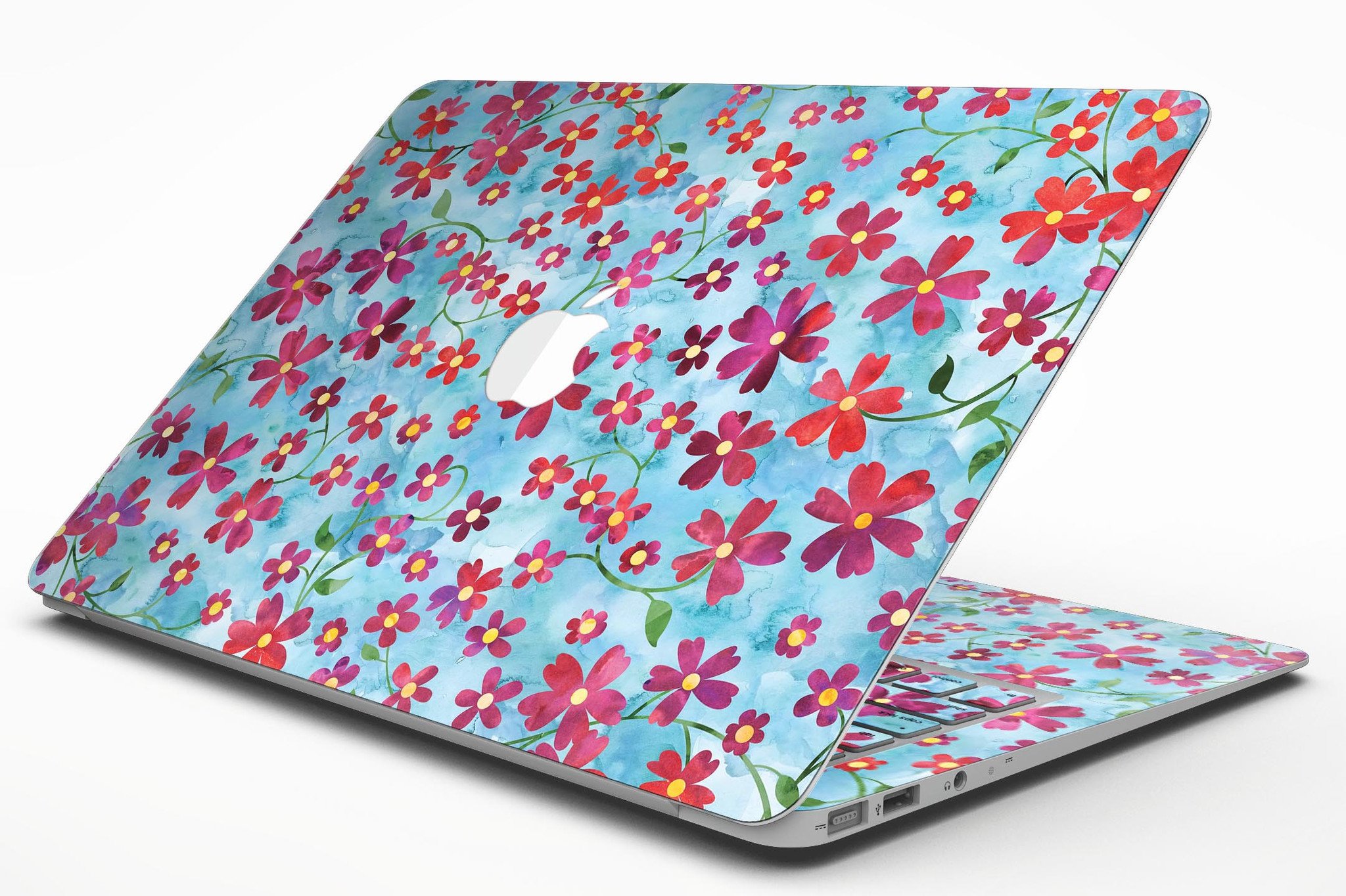 A MacBook Air adorned with a Flowers with Stems skin over a light blue watercolor background, showcasing its stylish design.