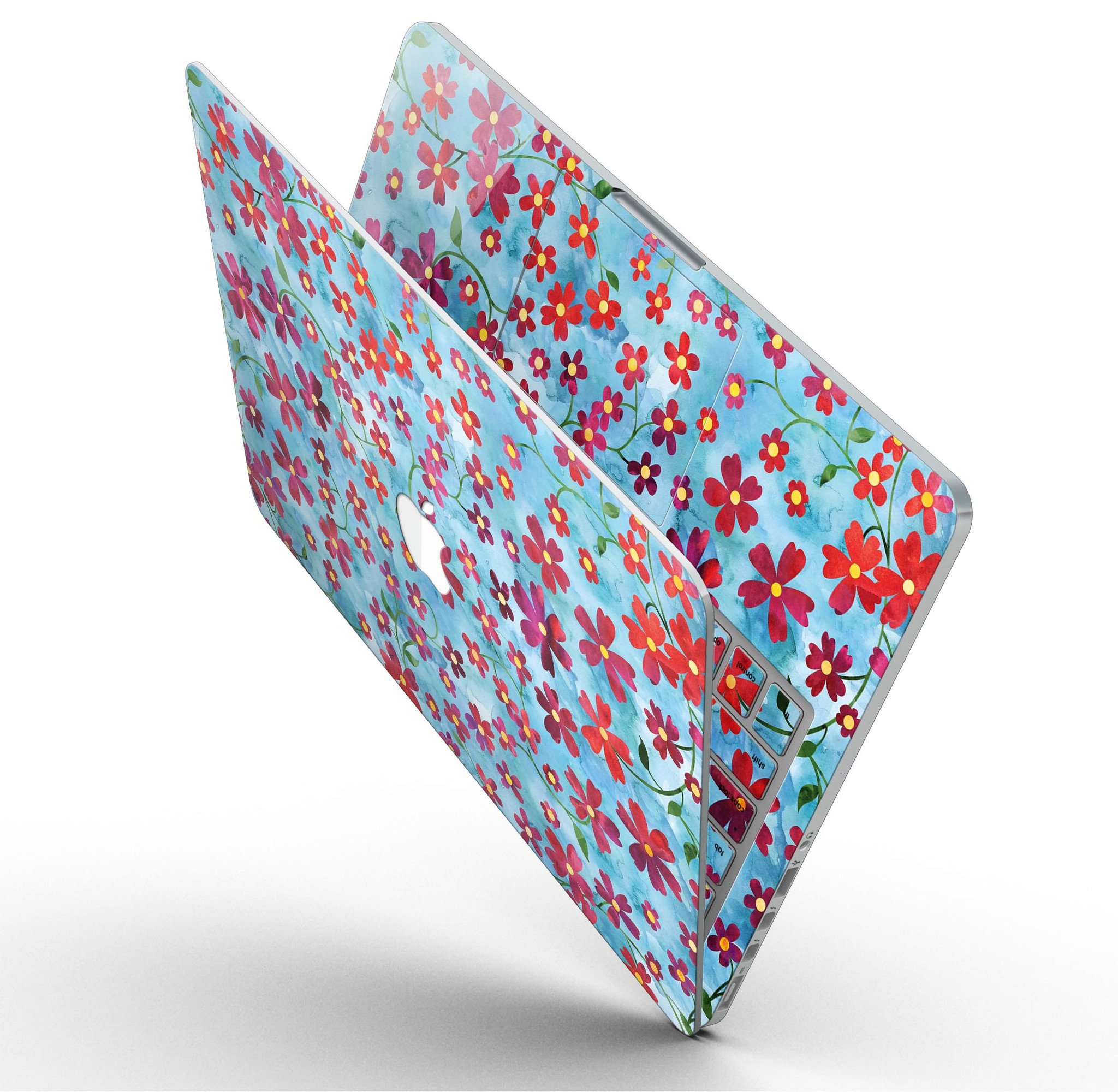 A MacBook Pro with a floral skin featuring stems over a light blue watercolor background, showcasing elegance and style.