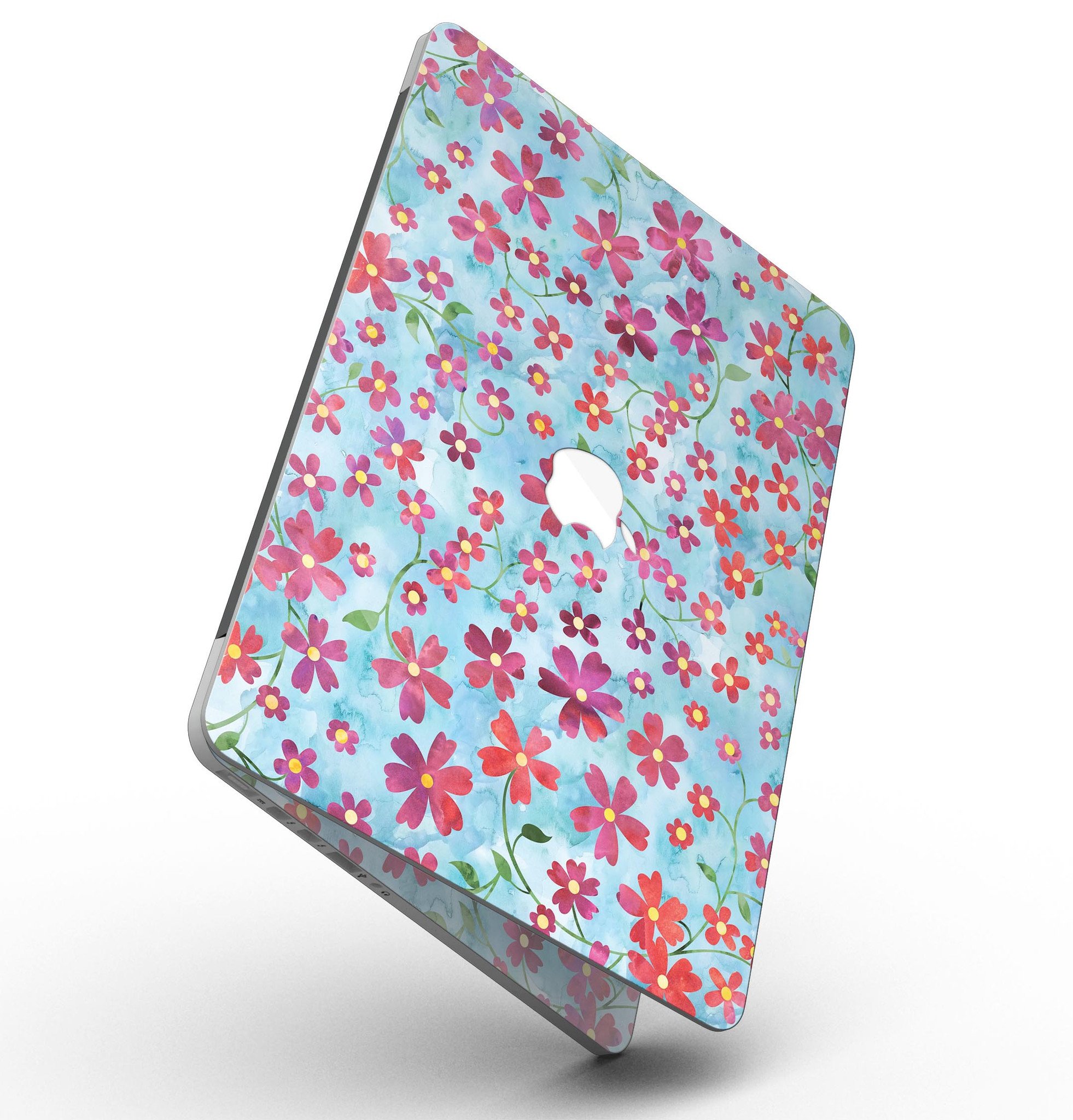 A MacBook Pro with a floral skin featuring stems over a light blue watercolor background, showcasing elegance and style.