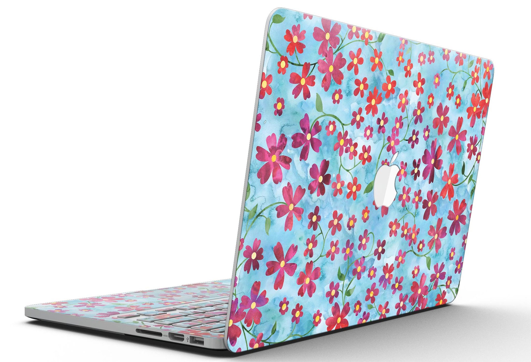 A MacBook Pro with a floral skin featuring stems over a light blue watercolor background, showcasing elegance and style.