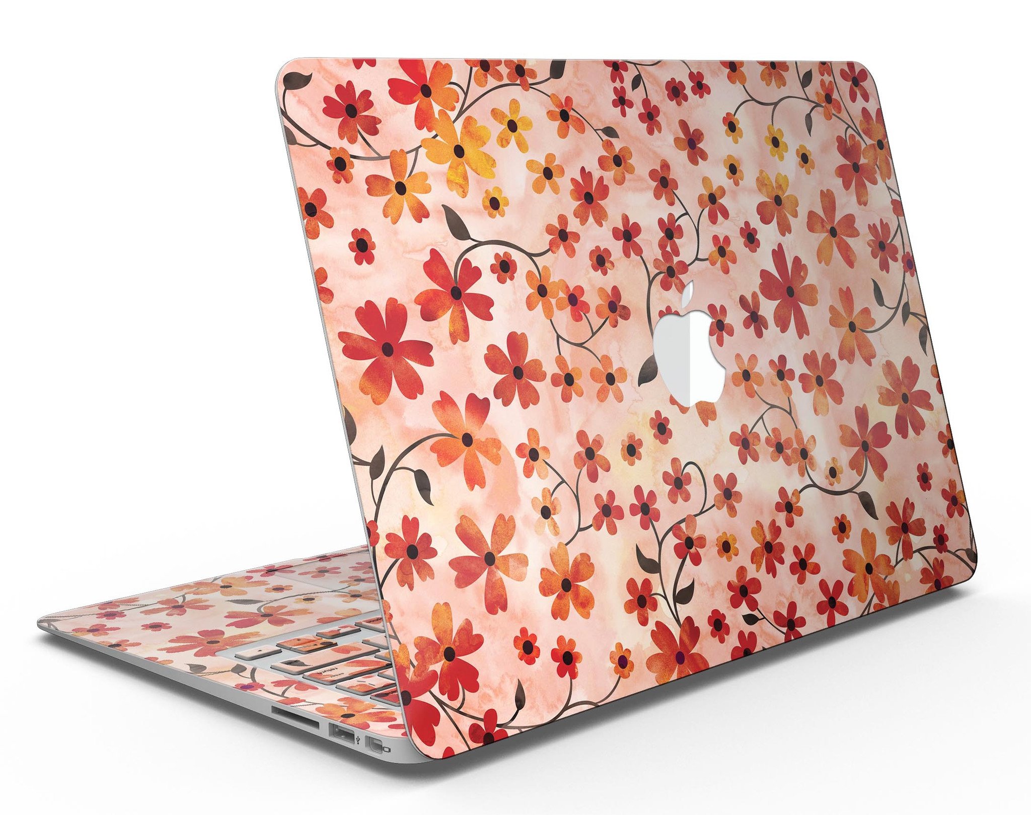 A vibrant MacBook Air skin featuring flowers with stems over an orange watercolor background, showcasing its stylish design.