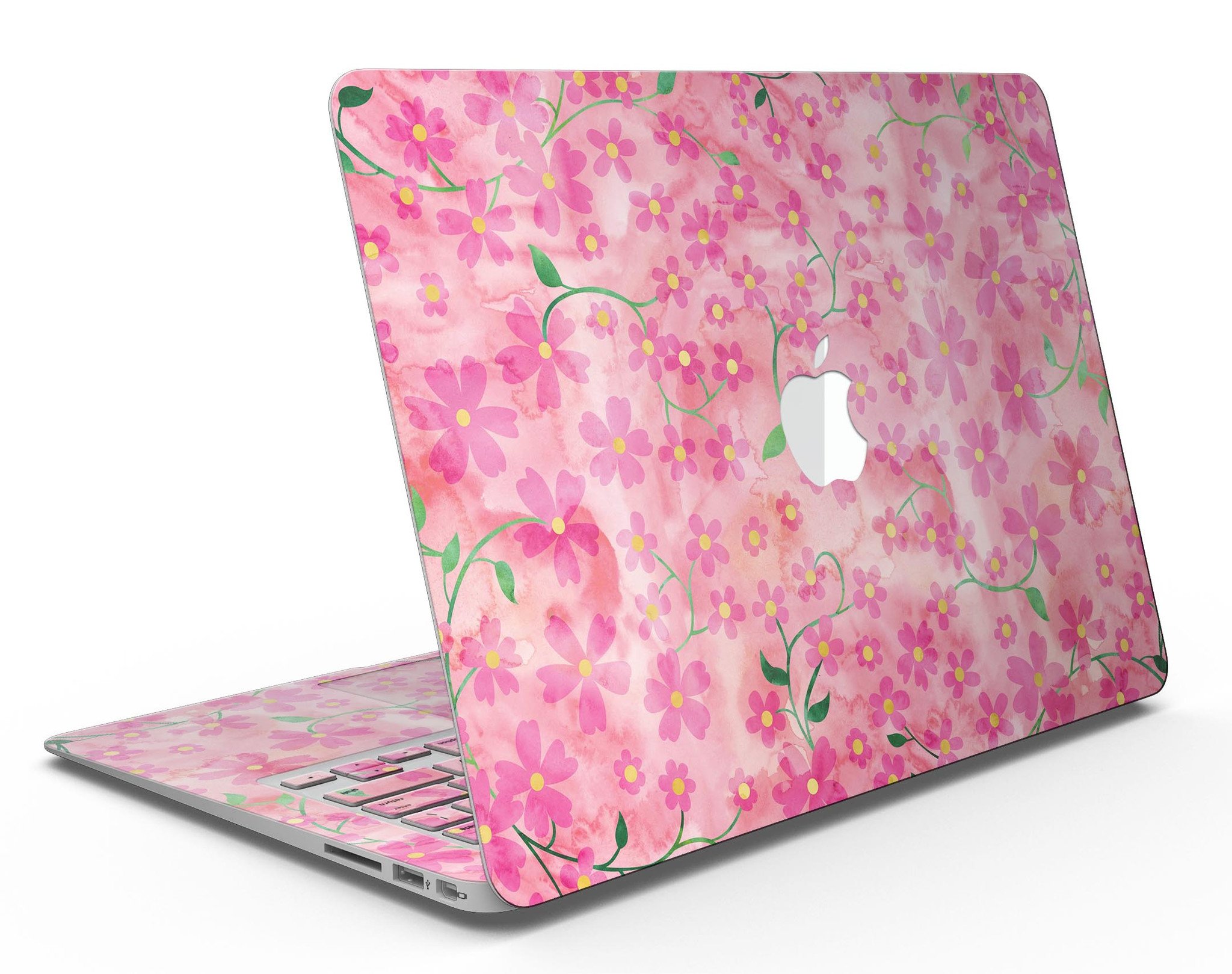 A MacBook Air adorned with a floral skin featuring stems over a pink watercolor background, showcasing vibrant colors and a stylish design.