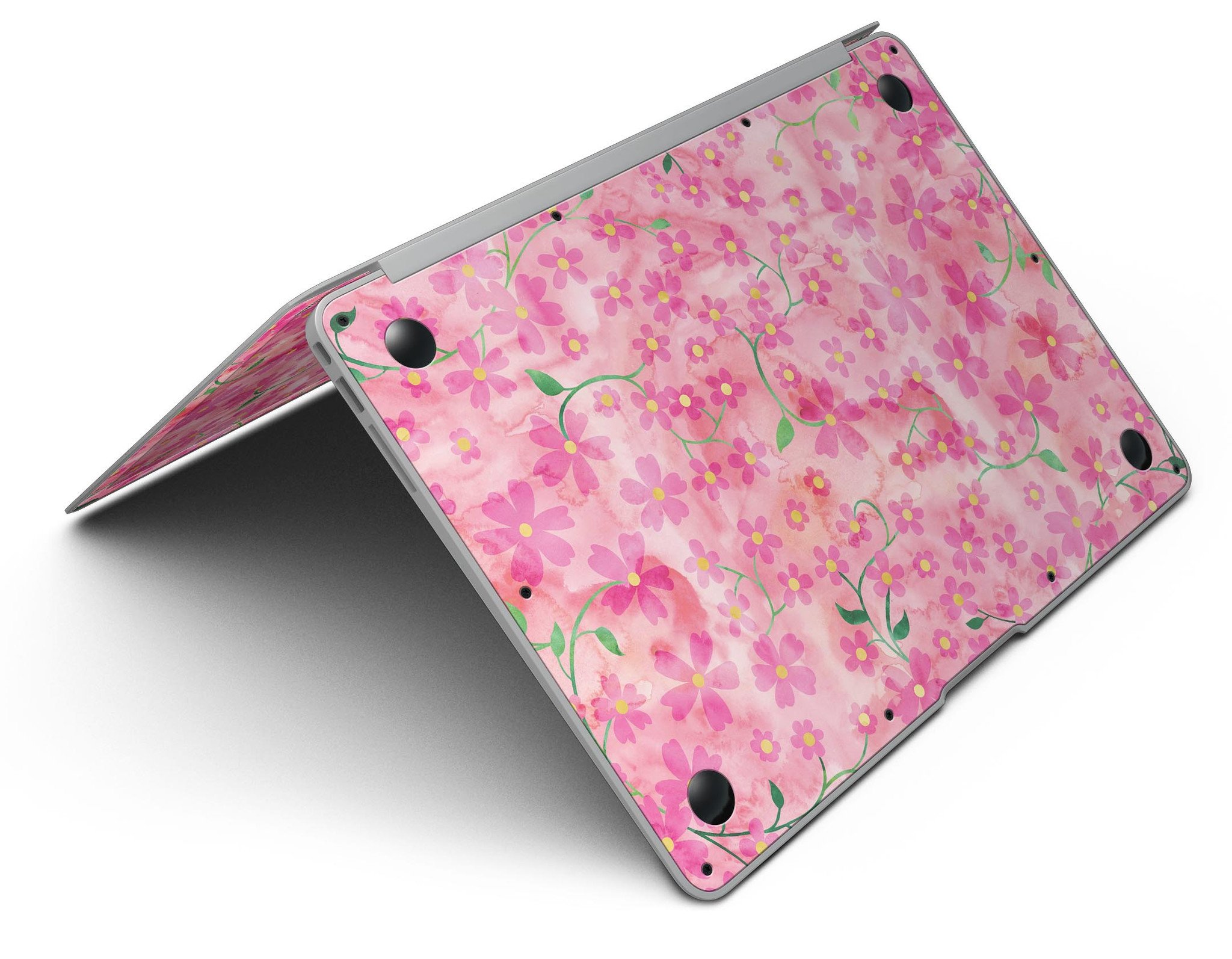 A MacBook Air adorned with a floral skin featuring stems over a pink watercolor background, showcasing vibrant colors and a stylish design.