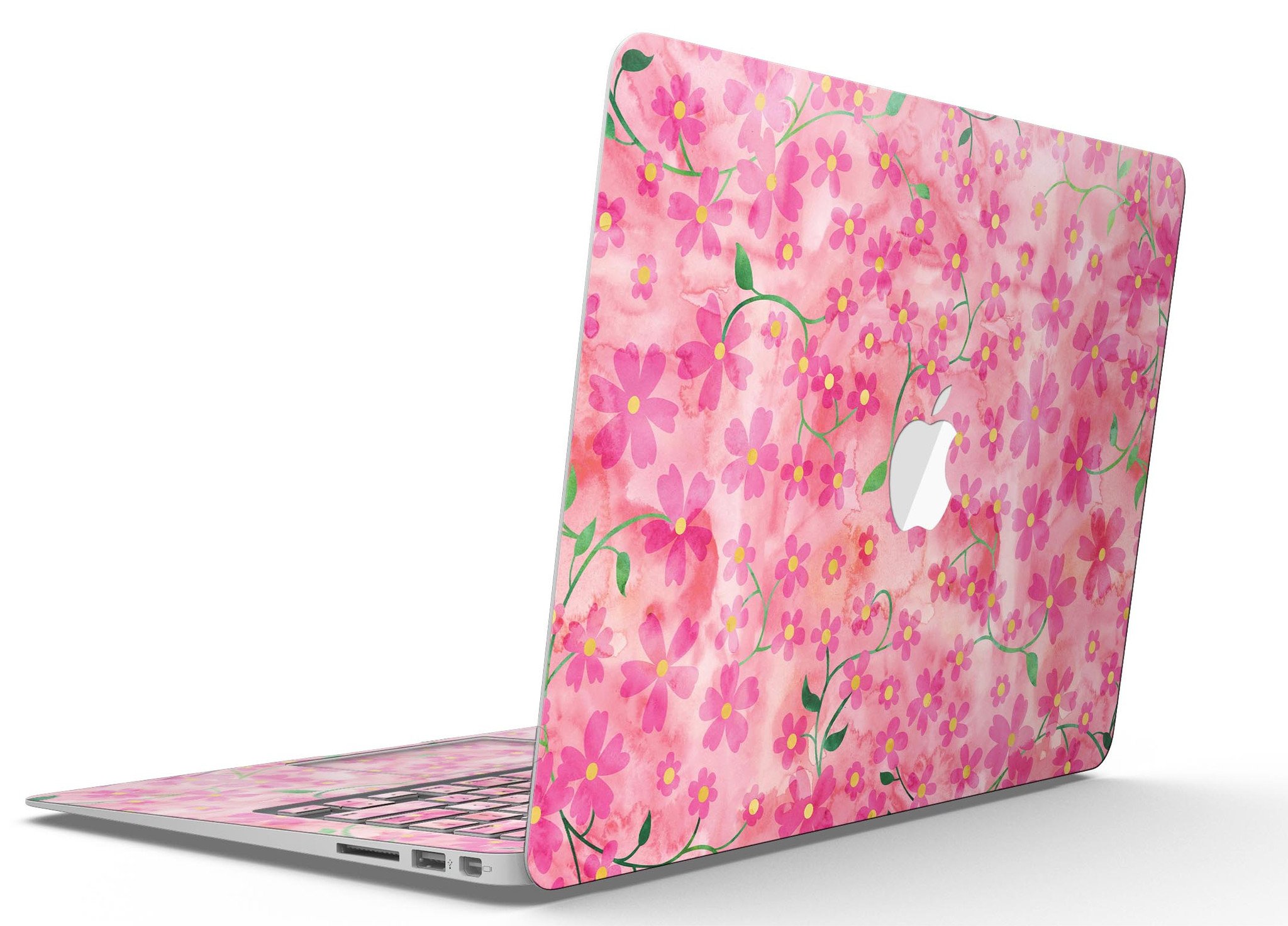 A MacBook Air adorned with a floral skin featuring stems over a pink watercolor background, showcasing vibrant colors and a stylish design.