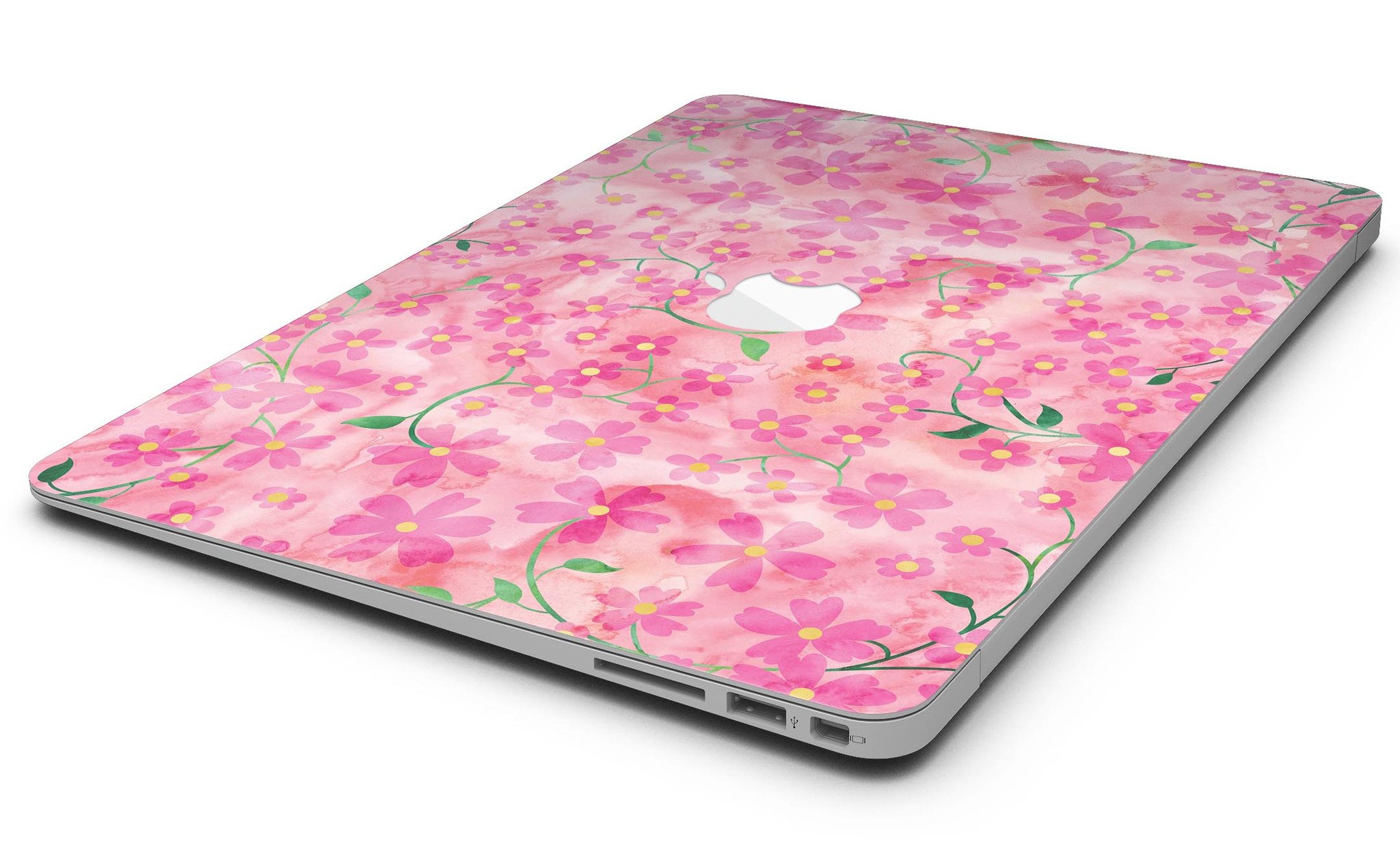 A MacBook Air adorned with a floral skin featuring stems over a pink watercolor background, showcasing vibrant colors and a stylish design.