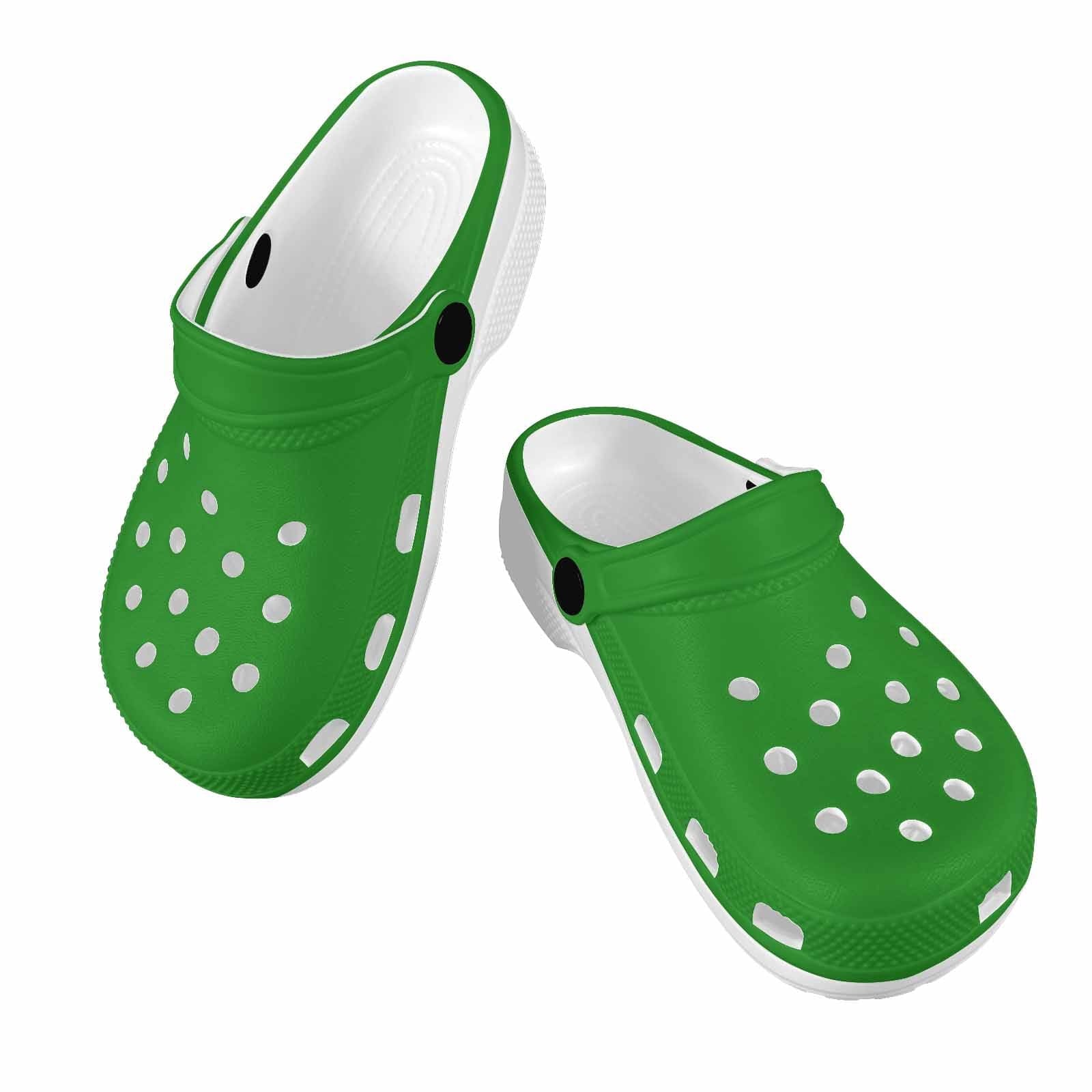 A pair of forest green clogs designed for youth, featuring a slip-on design, ventilation ports, and cushioned soles for comfort.